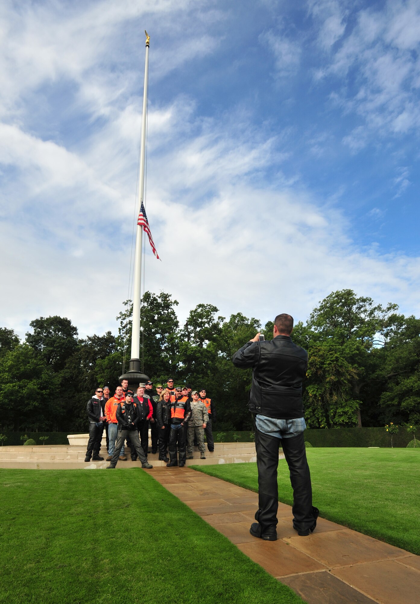 Members from RAF Lakenheath Rolling Thunder motorcycle rally pose for a photo Sept. 19, 2013, at Madingley American Cemetery near Cambridge, England. Madingley was established as the Cambridge American Military Cemetery in 1943 as a temporary cemetery, then officially named in July 1956. (U.S. Air Force photo by Senior Airman Christine Griffiths/Released)