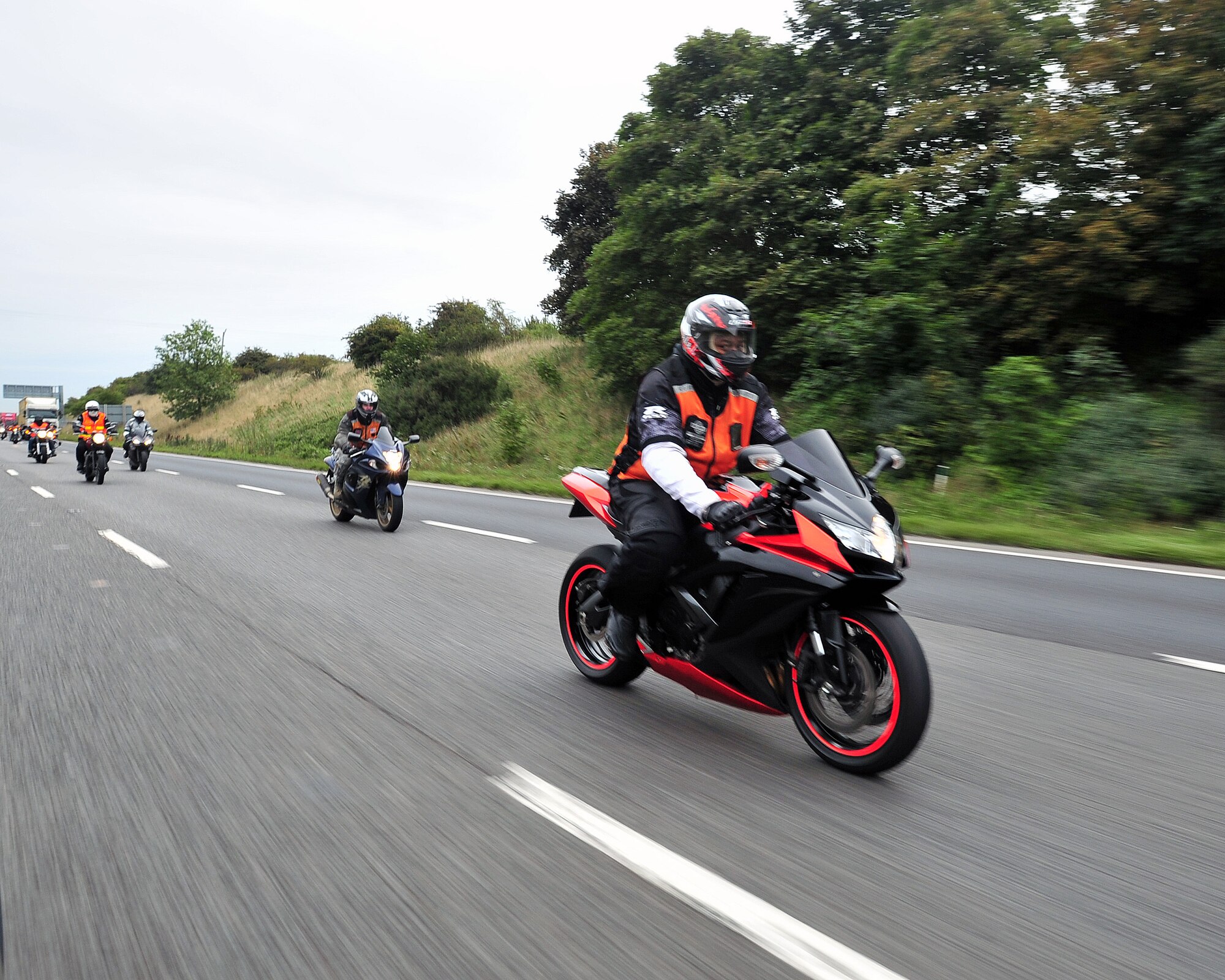 U.S. Air Force Staff Sgt. Damarious Farley, 100th Logisitics Readiness Squadron NCO in charge of outbound cargo, rides in the joint RAF Mildenhall and RAF Lakenheath Rolling Thunder motorcycle rally Sept. 19, 2013, to Madingley American Cemetery near Cambridge, England. This was his first year participating in the event.  (U.S. Air Force photo by Senior Airman Christine Griffiths/Released)