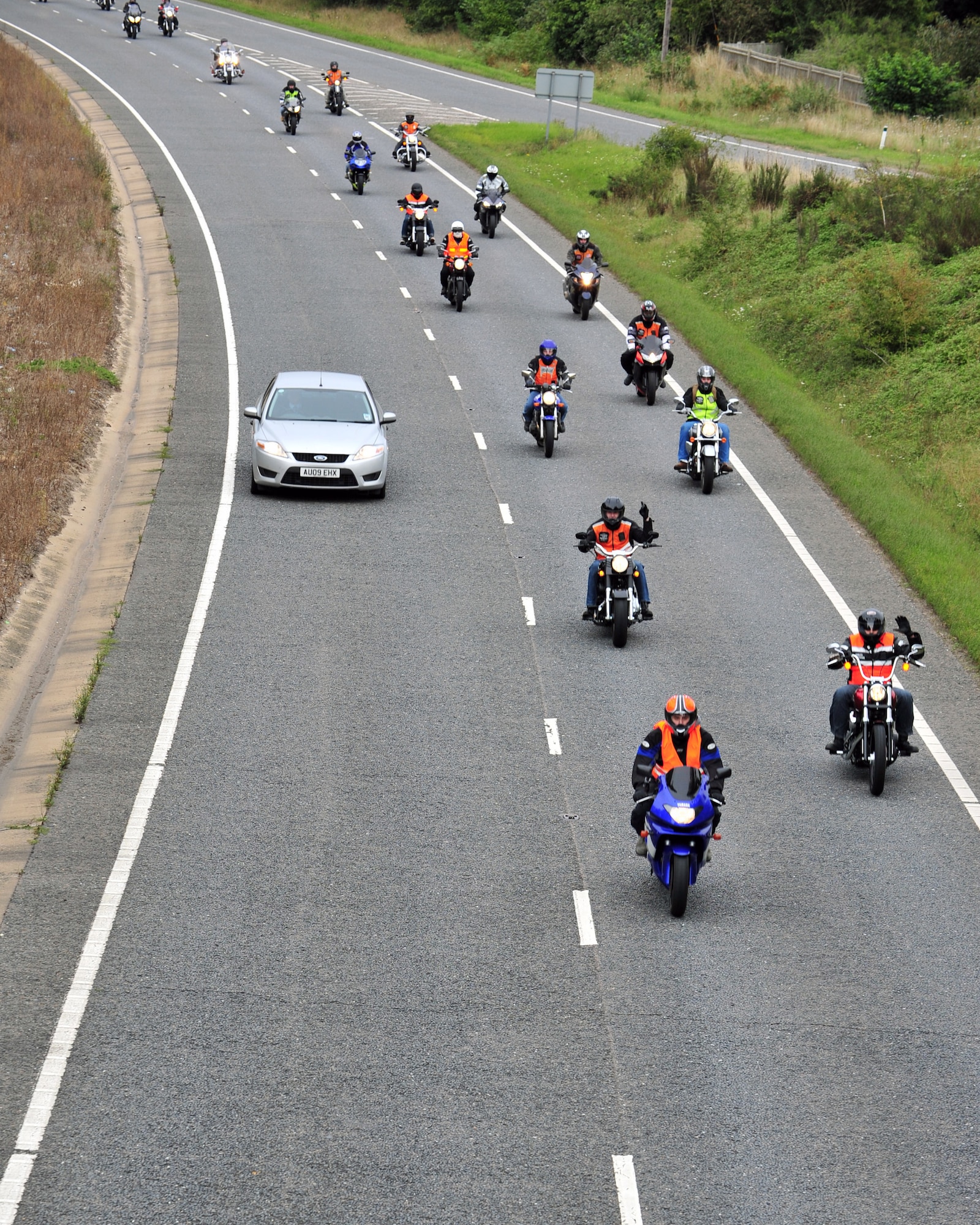 Participants of the joint RAF Mildenhall and RAF Lakenheath Rolling Thunder motorcycle rally make their way Sept. 19, 2013, to Madingley American Cemetery near Cambridge, England. The motorcycle ride began with the placing of a wreath at the Prisoners of War/Missing in Action memorial on RAF Lakenheath and ended on RAF Mildenhall. This is the fifth year the two bases have participated in the motorcycle rally. (U.S. Air Force photo by Senior Airman Christine Griffiths/Released)