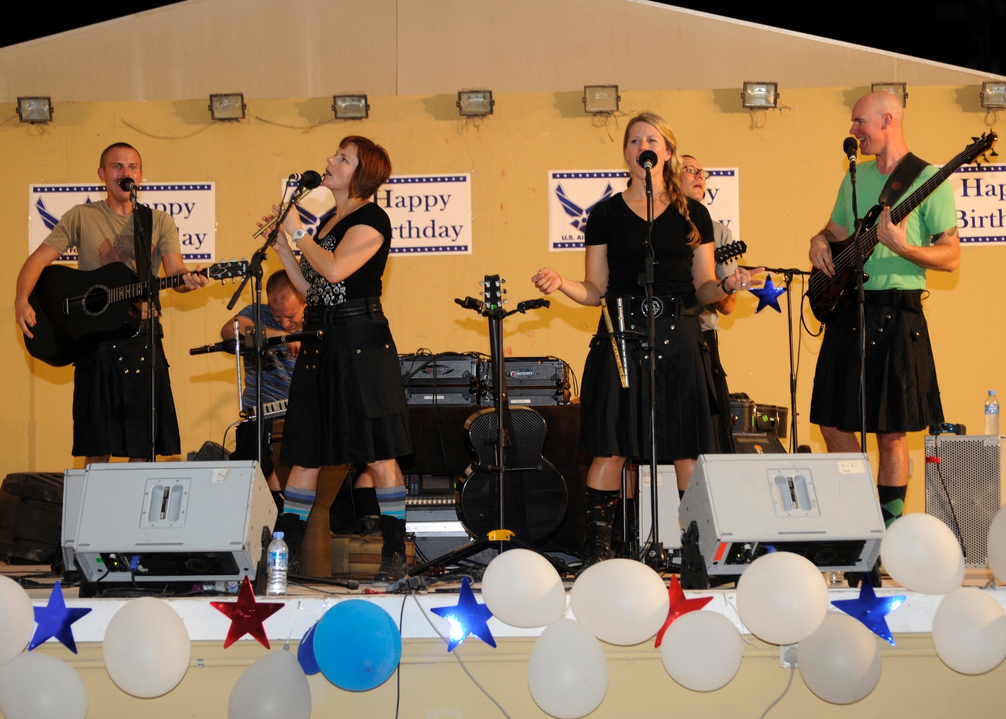 The U.S. Air Forces Central Command’s band, the “Blue Yonders,” perform in their Irish folk fashion during an Air Force Birthday celebration at the 379th Air Expeditionary Wing in Southwest Asia, Sept. 18, 2013. Grand Slam troops were treated to a full night of entertainment for the service’s 66th year. (U.S. Air Force photo/Senior Airman Bahja J. Jones)