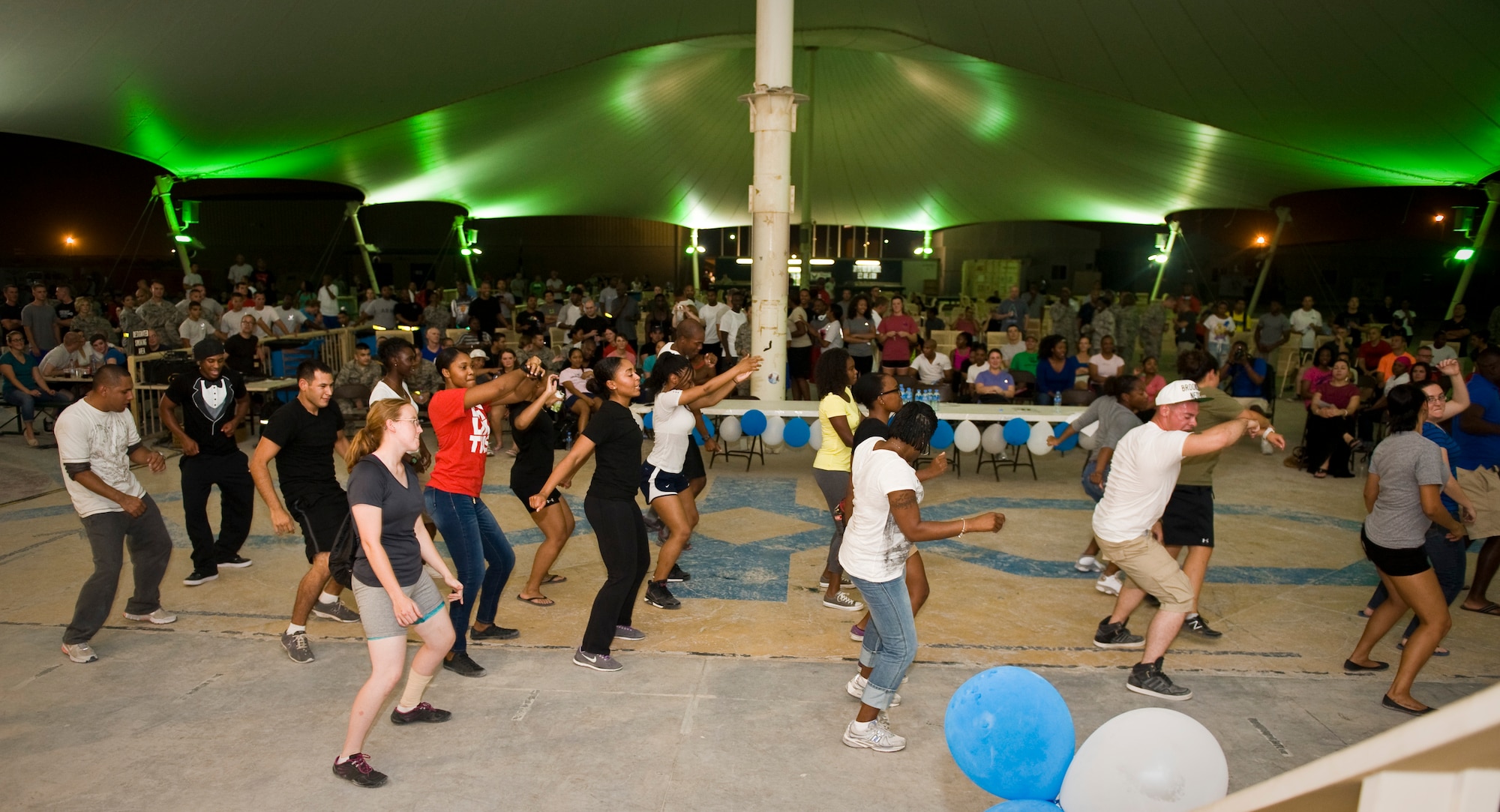 Service members break it down following the "You Got Served" dance competition at the 379th Air Expeditionary Wing in Southwest Asia, Sept. 18, 2013. The event pinned the wing's most talented dancers in a cut-throat show of skills and determination. (U.S. Air Force photo/Staff Sgt. Benjamin W. Stratton)
