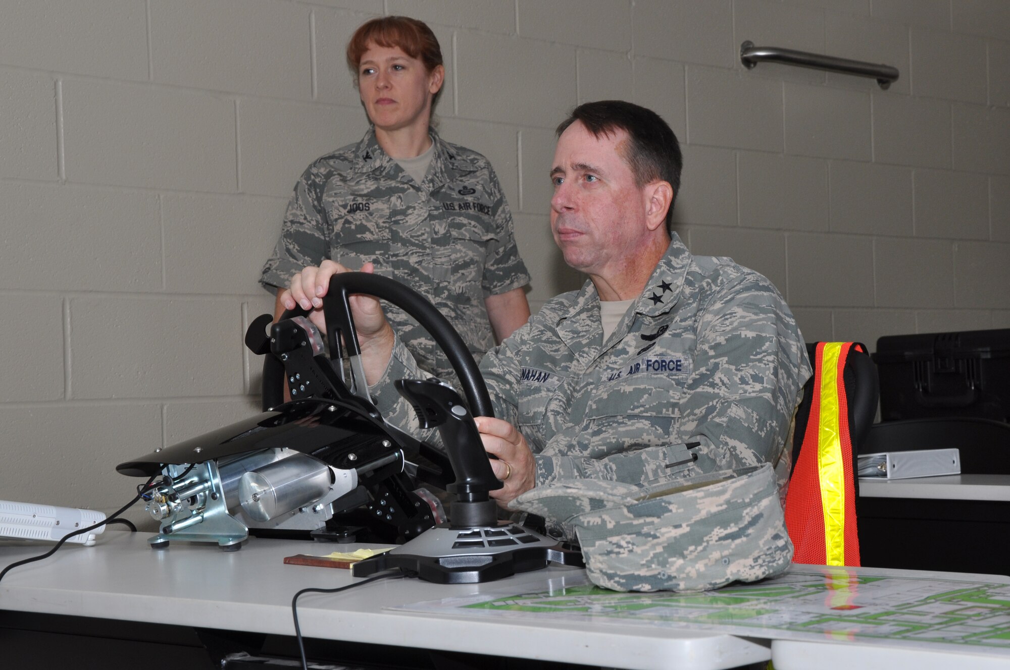 GOODFELLOW AIR FORCE BASE, Texas – Maj. Gen. John Shanahan, Air Force Intelligence, Surveillance and Reconnaissance Agency Commander, tests the Advanced Disaster Management Simulator at the Louis F. Garland Department of Defense Fire Academy Sept. 13. The ADMS simulator includes a virtual replica of the Norma Brown trainer, staffed vehicles and a variety of scenarios including aircraft and structural fires. (U.S. Air Force photo/Airman 1st Class Breonna Veal)