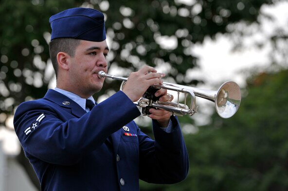 U.S. Air Force Airman 1st Class William McDonald, 35th Civil Engineer Squadron operation management, plays taps during a Prisoner of War and Missing in Action Remembrance Ceremony at Misawa Air Base, Japan, Sept. 20, 2013. The ceremony was held to commemorate all service members who are or have been POW or MIA. (U.S. Air Force photo by Airman 1st Class Zachary Kee)