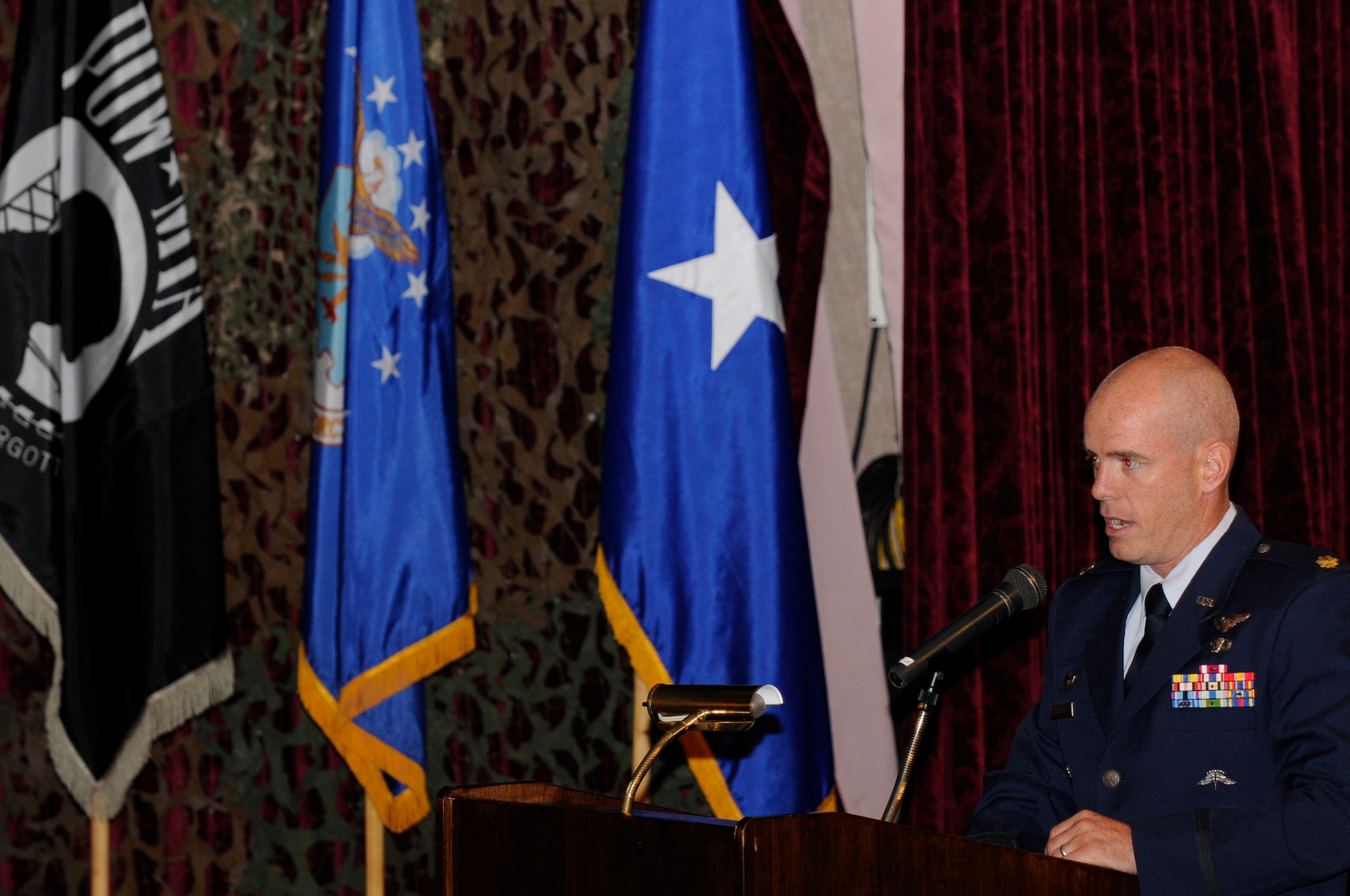 Maj. Charles Bris-Bois, 31st Rescue Squadron commander, speaks at a POW/MIA commemoration breakfast on Kadena Air Base, Japan, Sept. 20, 2013. Bris-Bois talked about how we must learn from the battle at Koh Tang Island and keep constant vigilance for our POW/MIA. (U.S. Air Force photo by Senior Airman Marcus Morris)