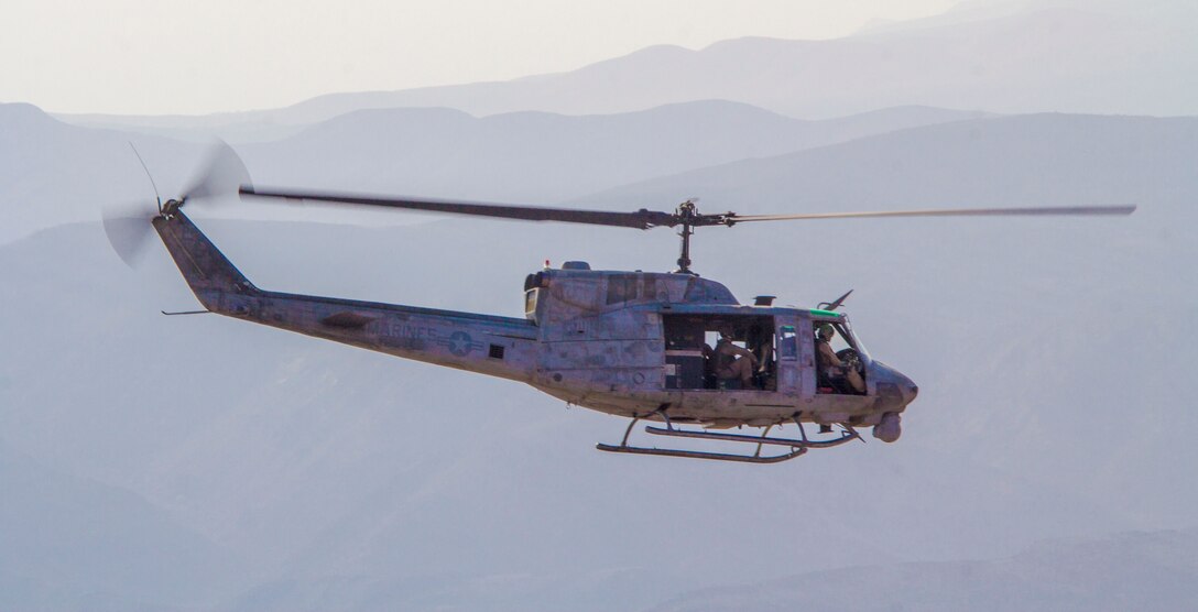 A UH-1N Huey assigned to Marine Medium Tiltrotor Squadron (VMM) 266 (Reinforced), 26th Marine Expeditionary Unit (MEU), flies above Camp Lemonnier, Djibouti, Sept. 18, 2013. The 26th MEU is a Marine Air-Ground Task Force forward-deployed to the U.S. 5th and 6th Fleet areas of responsibility aboard the Kearsarge Amphibious Ready Group serving as a sea-based, expeditionary crisis response force capable of conducting amphibious operations across the full range of military operations. (U.S. Marine Corps photo by Cpl. Kyle N. Runnels/Released)