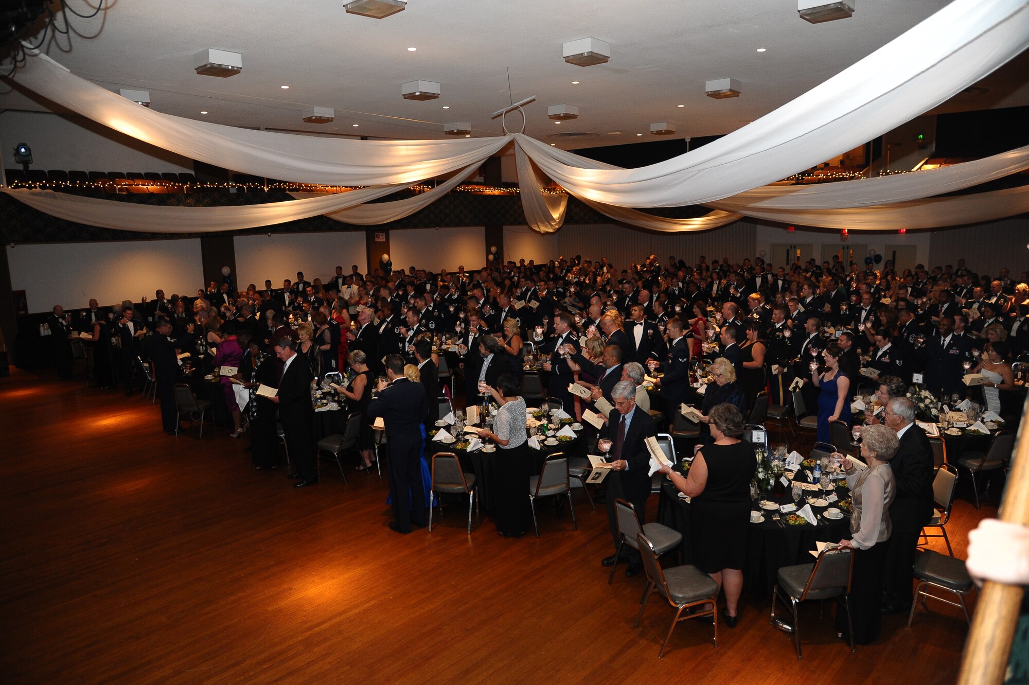 The audience at the 2013 Air Force Birthday Ball raises their glasses for a toast Sept. 20 at the Trotter Convention Center. The toasts honor Air Force senior leadership, the president and the men and women fighting for their country. (U.S. Air Force Photo/Airman 1st Class Stephanie Englar)