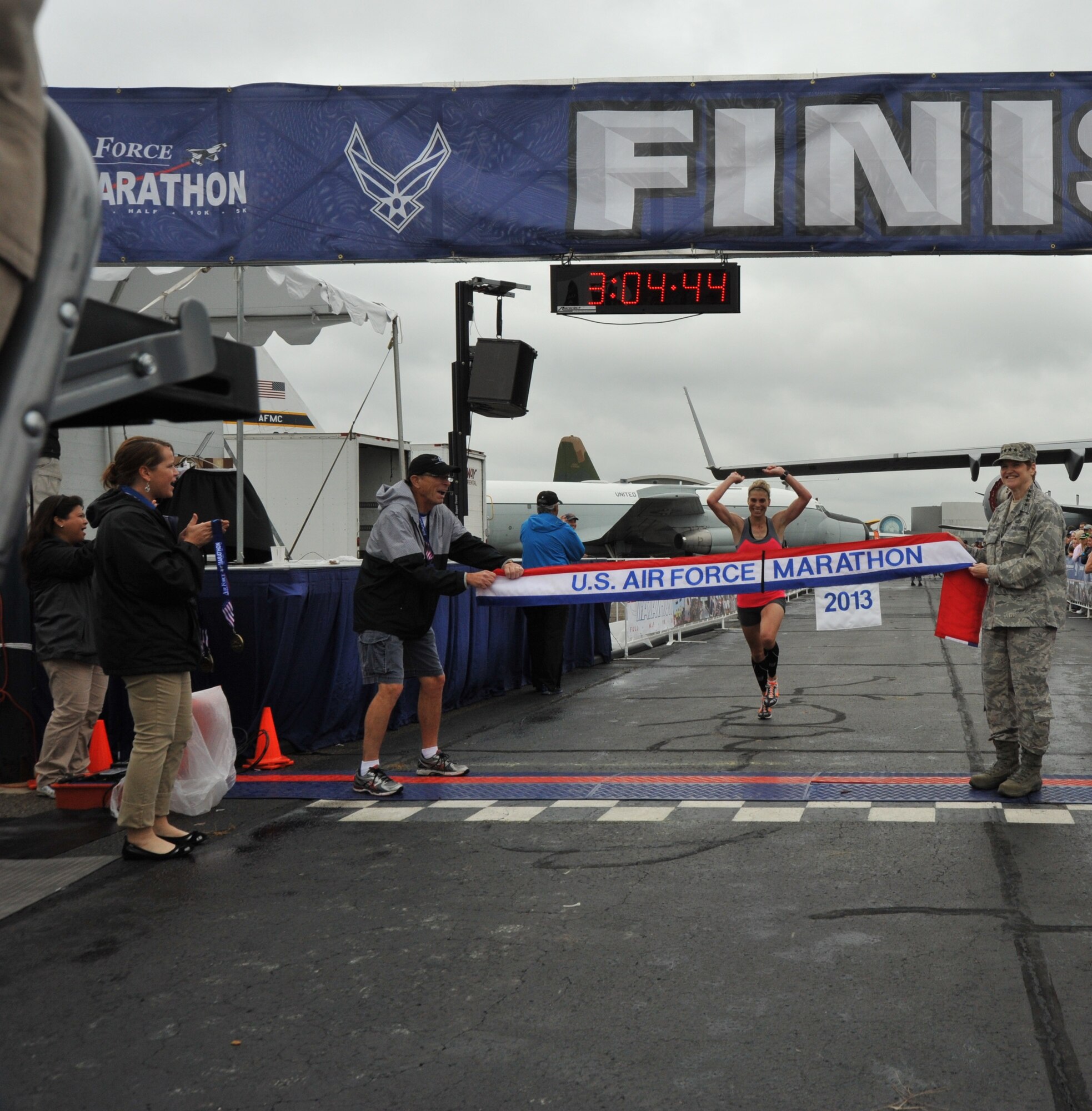 Michelle Farr, 40, Medina, Ohio, crosses the finish line to capture the U.S. Air Force Marathon women's full marathon event at a time of 3:04:44, Sept. 21. (U.S. Air Force photo/Michelle Gigante) 
