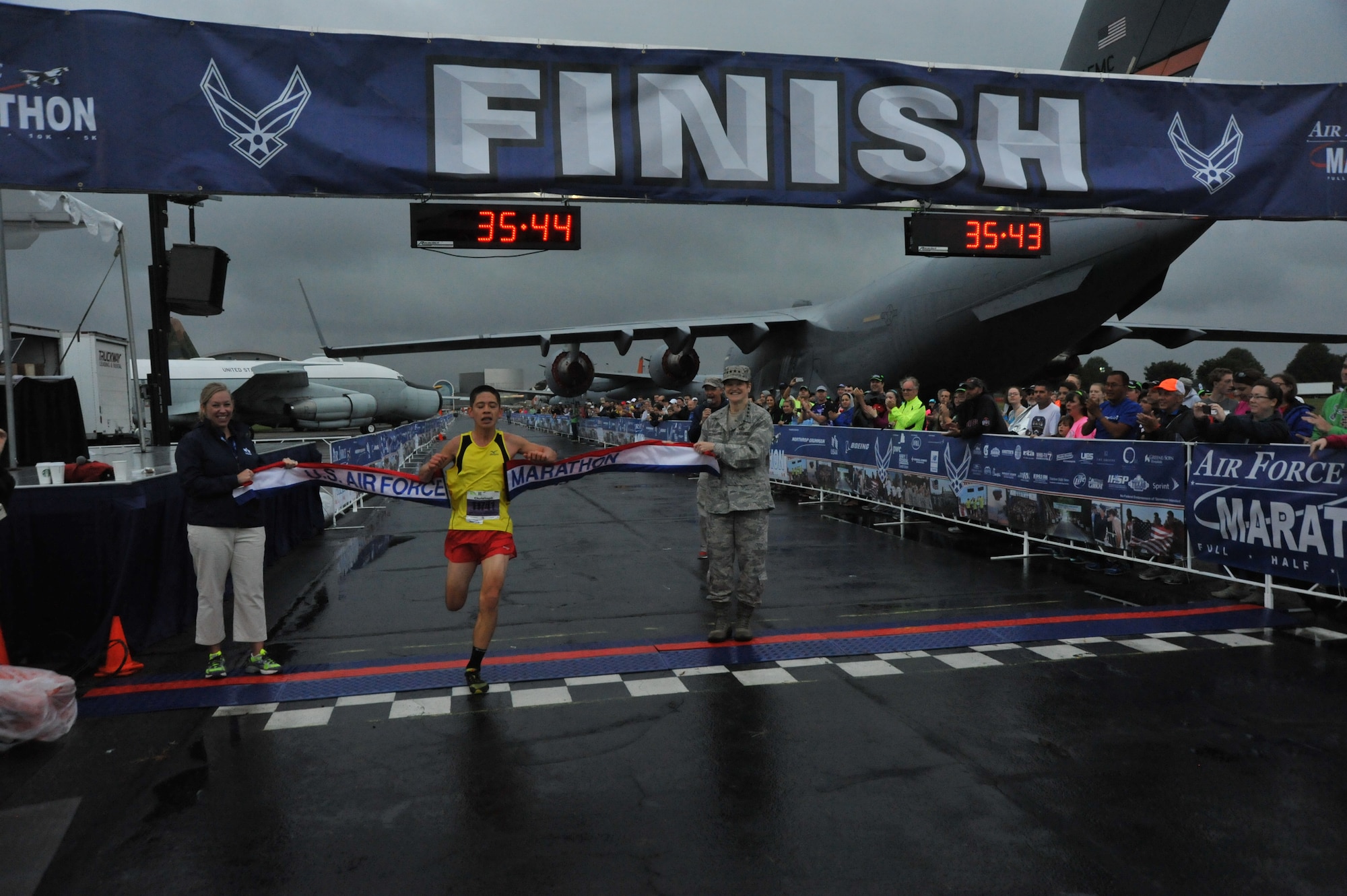 Christoph Cikraji, 14, of Durango Colo., crosses the finish line to capture the 10K crown at 35:46. (U.S. Air Force photo/Michelle Gigante) 
