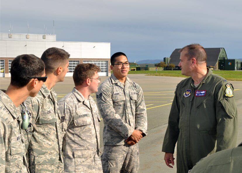 U.S. Air Force Col. Kenneth T. Bibb Jr., right, 100th Air Refueling Wing commander, and Senior Airman Lewius Hoang, 100th Aircraft Maintenance Squadron aircraft communications and navigation systems journeyman, end of the line, talk about Hoang's time supporting the Arctic Challenge exercise Sept. 19, 2013, on Ørland Main Air Station, Norway. Hoang, along with other Airmen, supported the exercise to enable air crews from five nations and NATO to train in the air together. (U.S. Air Force photo by 1st Lt. Christopher Mesnard/Released) 
