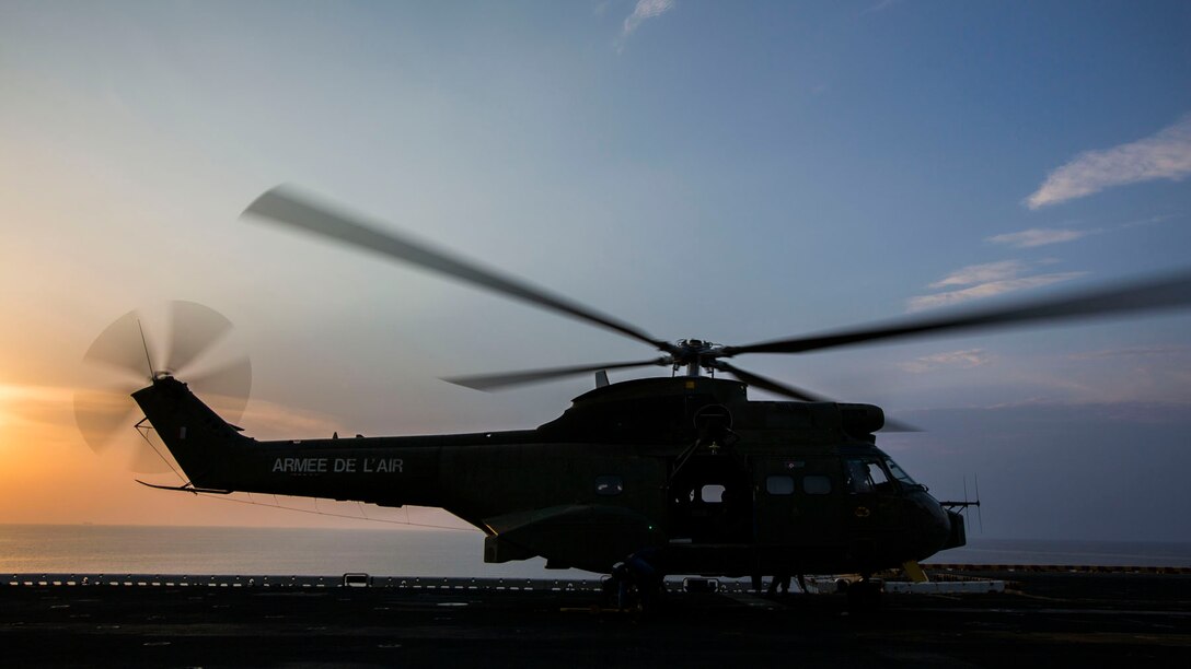 A French SA 330 Puma helicopter carrying 26th Marine Expeditionary Unit (MEU) senior leaders, prepares to take takeoff from the flight deck of the USS Kearsarge (LHD 3), Sept. 22, 2013. The 26th MEU is a Marine Air-Ground Task Force forward-deployed to the U.S. 5th and 6th Fleet areas of responsibility aboard the Kearsarge Amphibious Ready Group serving as a sea-based, expeditionary crisis response force capable of conducting amphibious operations across the full range of military operations. (U.S. Marine Corps photo by Sgt. Christopher Q. Stone, 26th MEU Combat Camera/Released)