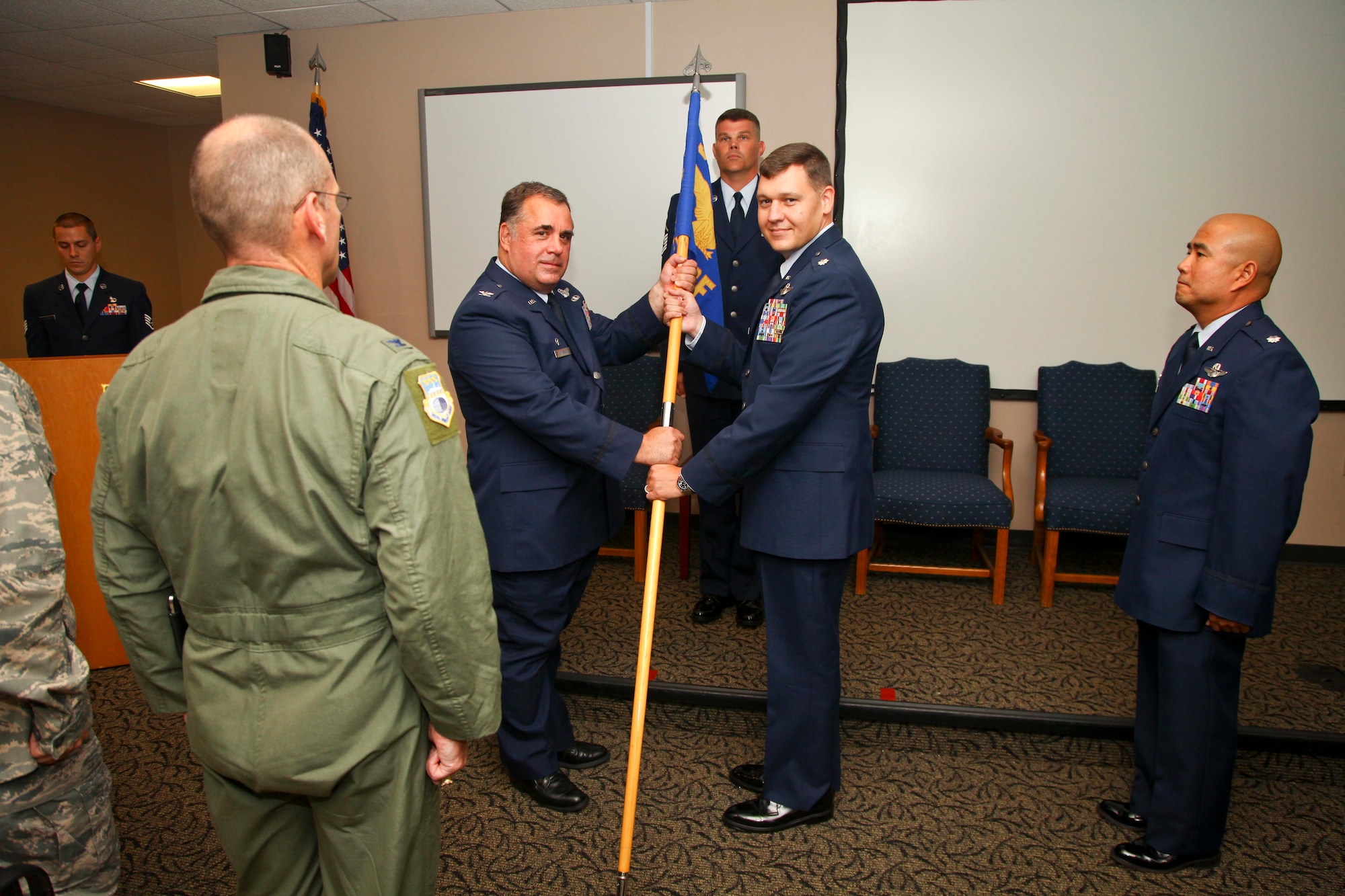Lt. Col. Don L. Thigpen II accepts the 315th Airlift Control Flight guidon during a change of command ceremony today in the Yonkie Auditorium here at Joint Base Charleston, S.C. Thigpen is succeeding previous commander Lt. Col. Zebedee O. T. Lau as the unit’s commander. (U.S. Air Force photo by Staff Sgt. Rashard Coaxum/released)