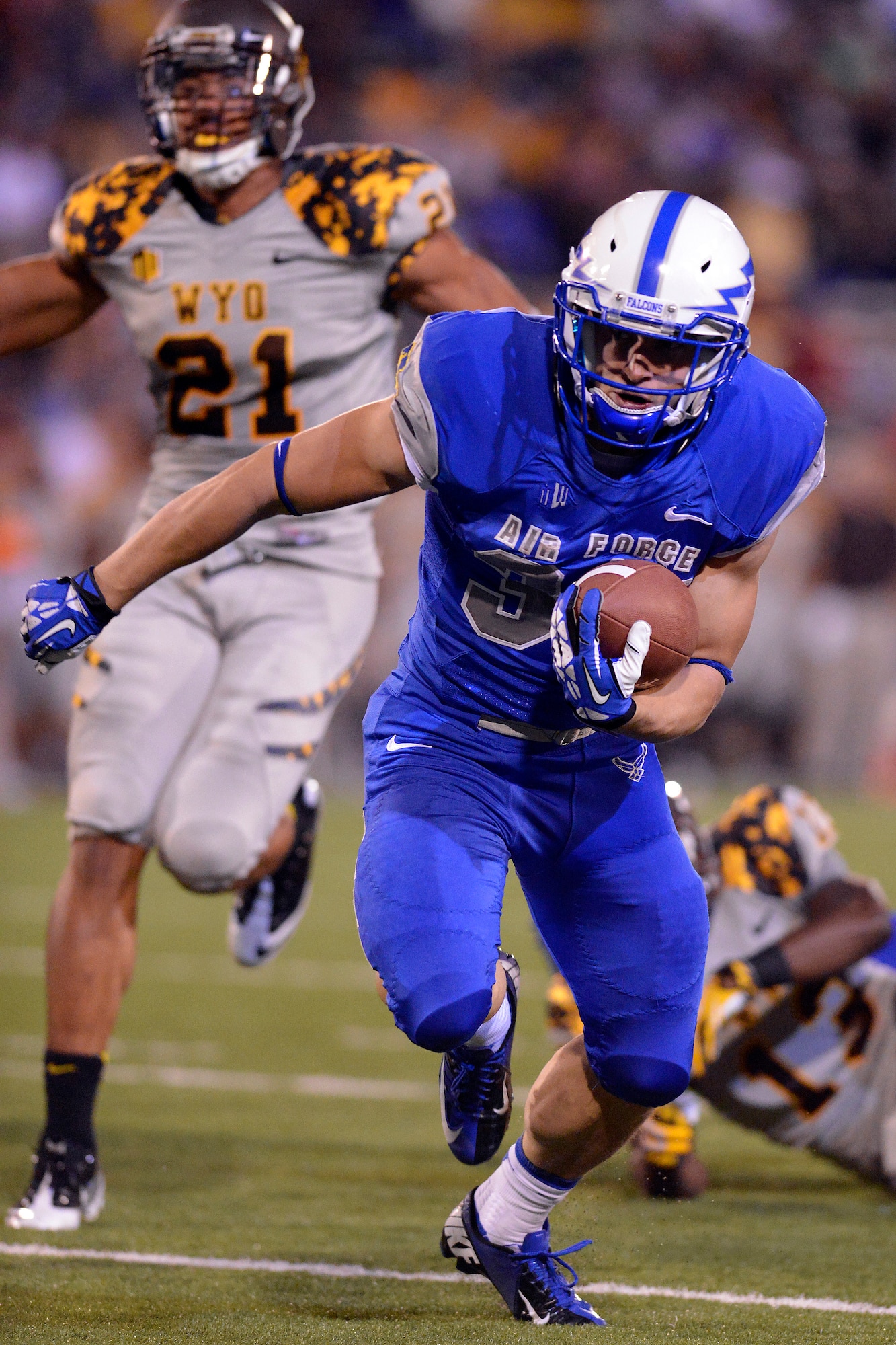 Air Force senior running back Anthony LaCoste finds open space in the Wyoming defense during the Falcons-Cowboys game at Falcon Stadium Sept. 21, 2013. LaCoste accounted for 27 yards on nine carries and one touchdown in the Falcons' 56-23 defeat. (U.S. Air Force photo/Mike Kaplan)