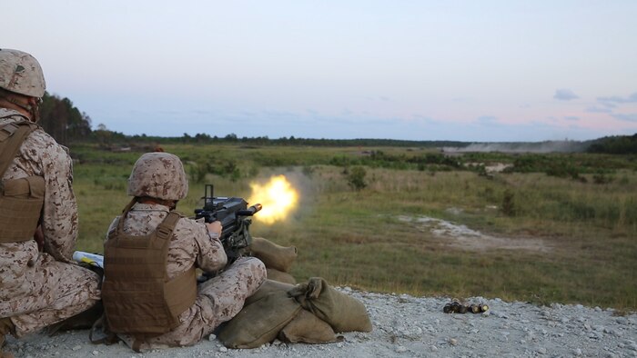 A Marine with Bridge Company, 8th Engineer Support Battalion, 2nd Marine Logistics Group fires an automatic Mk. 19 Grenade Launcher at targets approximately 1,000 yards away during a grenade training exercise aboard Camp Lejeune, N.C., Sept. 17, 2013. The Mk. 19s were used alongside other grenade systems to provide the Marines experience with the devastating weapons. 