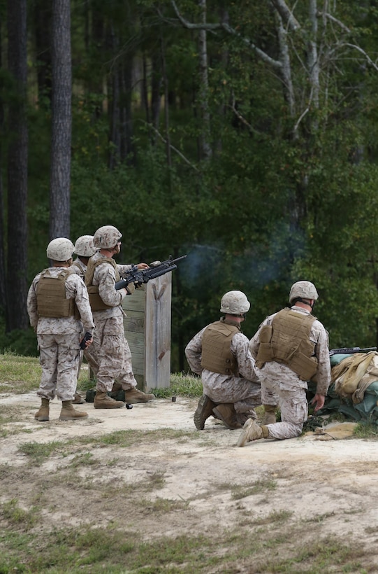 A Marine with Bridge Company, 8th Engineer Support Battalion, 2nd Marine Logistics Group fires an M-203 grenade launcher downrange as part of a grenade training exercise aboard Camp Lejeune, N.C., Sept. 17, 2013. The operation provided the service members of Bridge Co. an opportunity to become familiar with different grenade systems.
