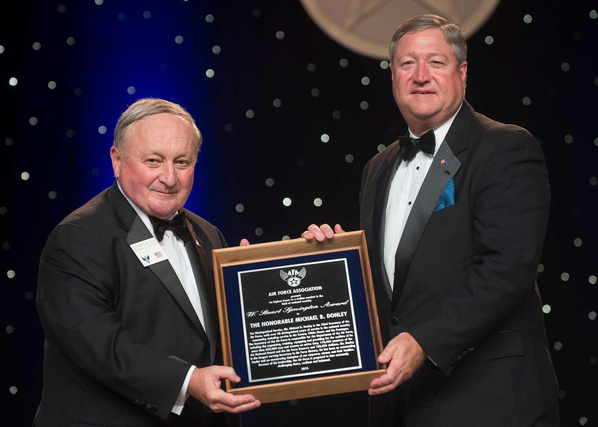 Former Secretary of the Air Force Michael Donley gives comments after accepting the W. Stuart Symington Award during the United States Air Force Anniversary Dinner Sept. 18, 2013, at the National Harbor, Washington, D.C. The dinner celebrated the 66th Anniversary of the Air Force during the Air Force Association's 2013 Air & Space Conference and Technology Exposition. AFA sponsors the annual conference to promote professional development in support of the total Air Force. Named after the first Secretary of the Air Force the W. Stuart Symington award is presented for the most significant contribution by a civilian in the field of national defense. (U.S. Air Force photo/Jim Varhegyi)
