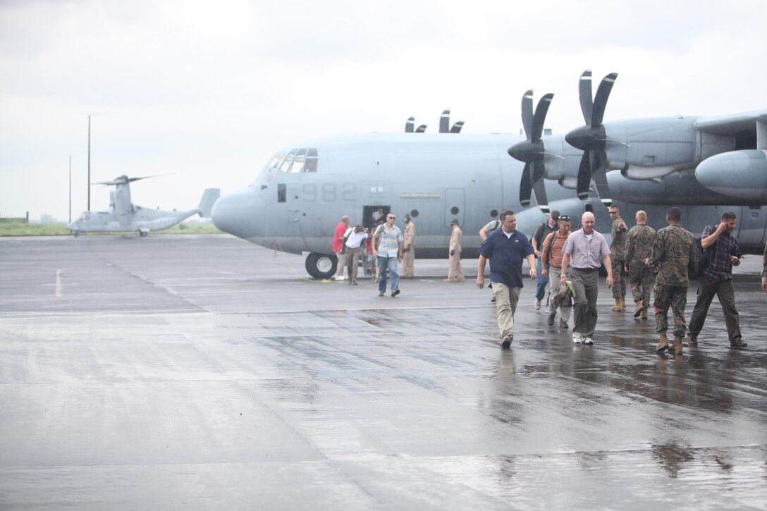 Marines with the advanced party for Amphibious Landing Exercise 2014 disembark a KC-130 Hercules Sept. 14 at Clark Air Field, Pampanga, Republic of the Philippines. The Marines, with the 13th Marine Expeditionary Unit, 3d Marine Expeditionary Brigade and III Marine Expeditionary Force, will be providing support throughout the exercise. Bilateral training during PHIBLEX 14 is focused on enhancing interoperability and the readiness of forces.