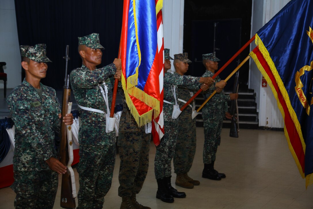 Philippine and U.S. Marines present organizational colors during the opening ceremony of Amphibious Landing Exercise 2014 at Naval Station Leovigildo, Sept. 18. PHIBLEX 14 is an annual, bilateral training exercise that enhances security and stability within the region while also helping to prepare for humanitarian assistance and disaster relief missions. During the exercise, U.S. Marines, from the 13th Marine Expeditionary Unit, 3d MEB and III Marine Expeditionary Force, will partner with Philippine Marines.