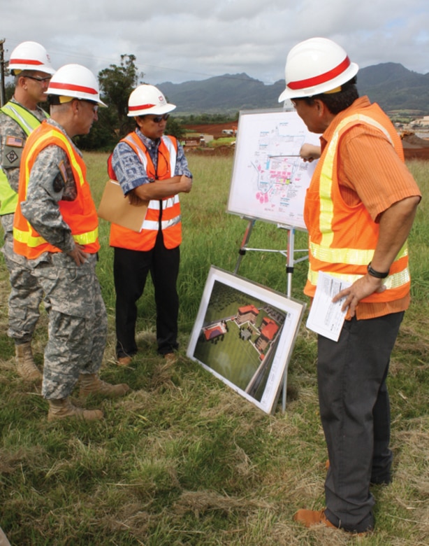 Pacific Ocean Division Commander Brig. Gen. Richard L. Stevens (second from left) listens to an on-site construction briefing by Schofield Barracks Area Office Resident Engineer Darren Carpenter (right) about the 25th Infantry Division Combat Aviation Brigade infrastructure Phase 1 project. Listening are Honolulu District Commander Lt. Col. Thomas D. Asbery (left) and Schofield Barracks Area Engineer Dickson Ma. The CAB Phase 1 project will be one of many to benefit from the implementation of the District’s Red Zone strategy.
