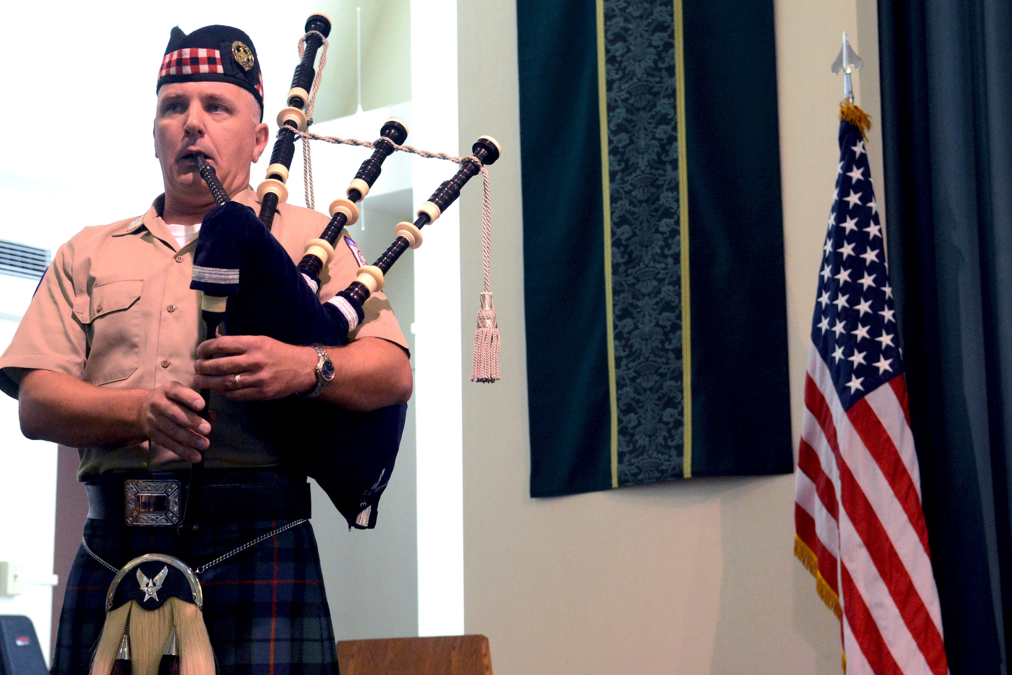 Master Sgt. Iain Morrison, 554th RED HORSE Squadron engineering superintendent, plays bagpipes during the National Prisoner of War/Missing in Action Recognition Day ceremony on Andersen Air Force Base, Guam, Sept. 20, 2013. The ceremony followed a 24-hour vigil run on base which was held to honor prisoners of war and those missing in action. (U.S. Air Force photo by Airman 1st Class Mariah Haddenham/Released)