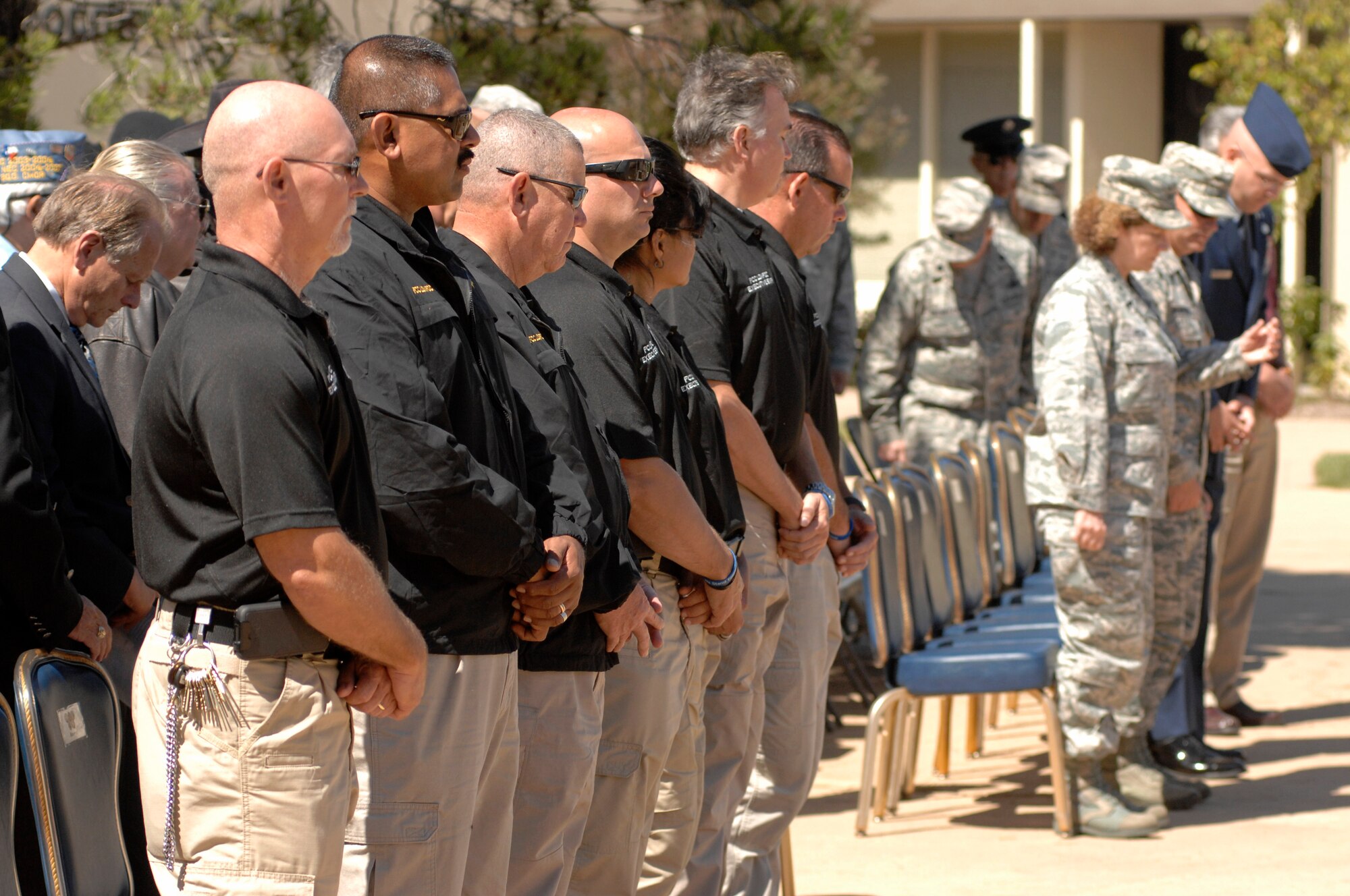 VANDENBERG AIR FORCE BASE, Calif. -- Guests in attendance stand for the opening invocation during the POW/MIA remembrance ceremony here Friday, Sept. 20. The ceremony marked the 34th United States' National POW and MIA Recognition Day observed across the nation on the third Friday of September each year and was preceded by a 24-hour name reading vigil. (U.S. Air Force Photo/Michael Peterson)