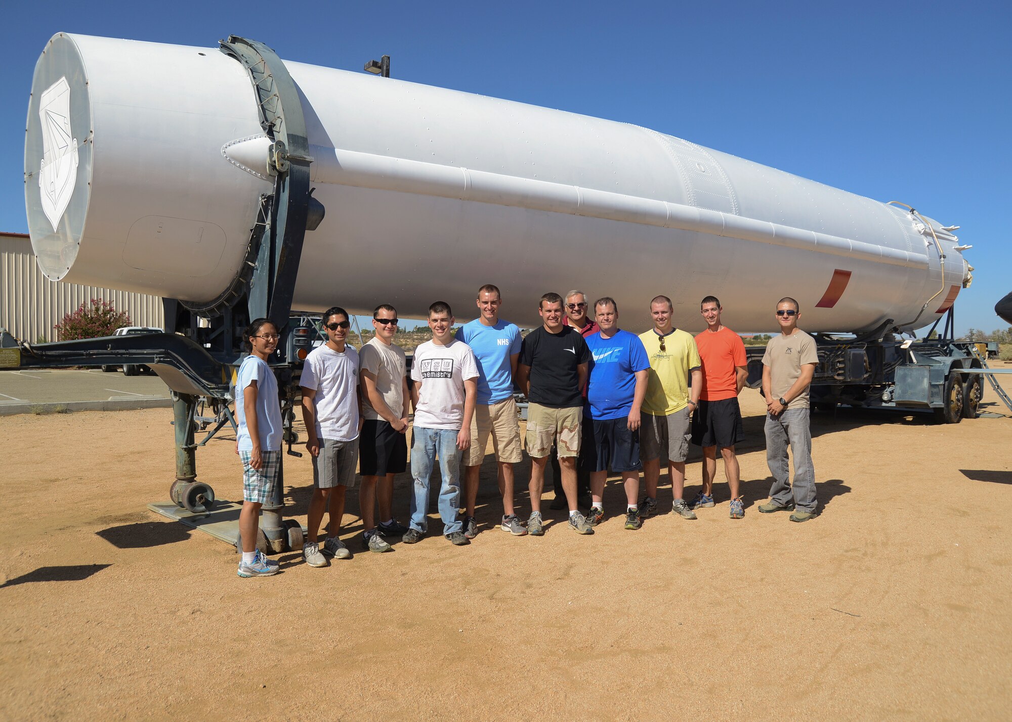 A group of Air Force Research Laboratory Detachment 7 volunteers painted the Douglas PGM-17A “Thor” missile in its original color scheme at the Air Force Flight Test Museum Sept. 20. (U.S. Air Force photo by Rebecca Amber)  