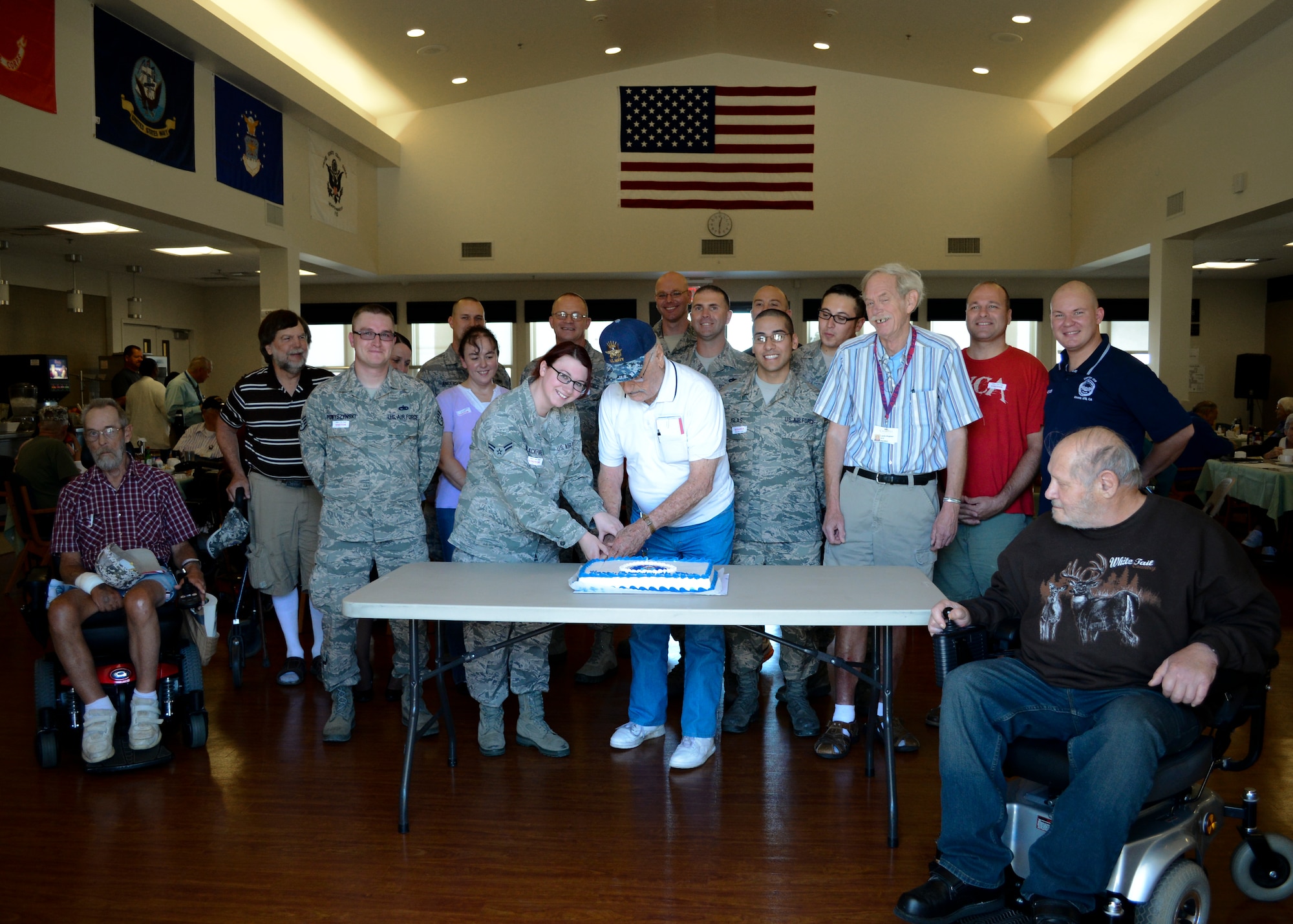 Veteran, Earl “Andy” Andrews, former Navy aviator, cuts the Air Force birthday cake surrounded by Air Force Sergeants Association volunteers and several other residents. AFSA served a barbeque lunch at the Lancaster Veterans Home of California Sept. 18, in honor of the 66th Air Force birthday.

