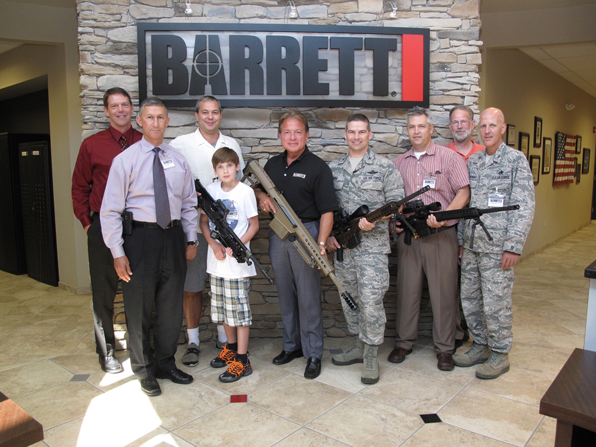 Left to right, AEDC Executive Director Douglas Blake, AEDC Chief of Staff Ken Jacobsen, Tennessee Representative Judd Matheny, Judd’s son Aulden, Barrett’s Firearms Manufacturing Inc. CEO Ronnie Barrett, AEDC Commander Col. Raymond Toth, AEDC Historian Chris Rumley, Matheny’s visitor Steve Chester and AEDC Test Support Division Director Col. James Krajewski take a break during AEDC’s recent visit to the Barrett Firearms factory near Murfreesboro. (Photo by Claude Morse)