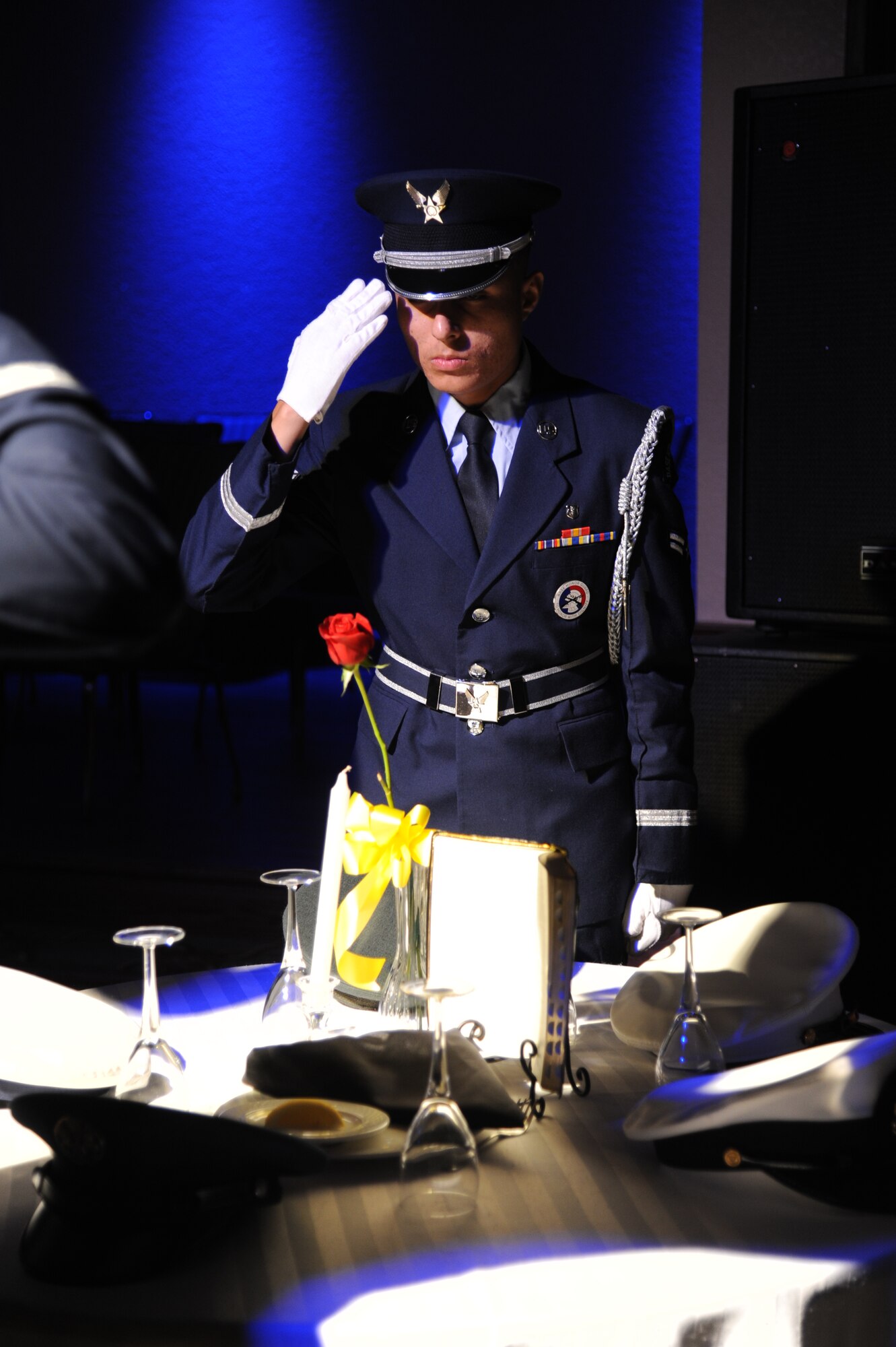Airman 1st Class Pedro Ayala, Keesler Honor Guard, renders a salute while performing a prisoner of war/missing in action table ceremony during the Air Force’s 66th Birthday Ball on Sept. 21, 2013, at Keesler Air Force Base, Miss. The event, sponsored by the Air Force Association, John C. Stennis Chapter #332, also celebrated the 81st Training Wing’s 20th anniversary.  (U.S. Air Force photo by Kemberly Groue)