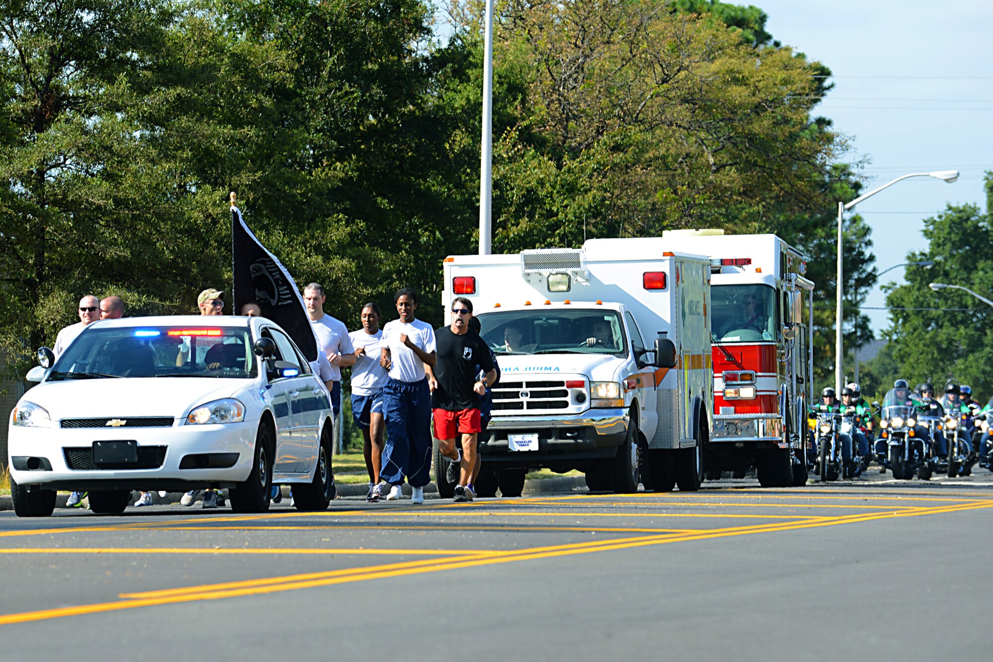 Service members, civilians and motorcyclists participate in the 2013 POW/MIA Recognition Day run at Langley Air Force Base, Va., Sept. 20, 2013. The event honored POWs and those MIAs across the nation. (U.S. Air Force photo by Airman 1st Class Victoria H. Taylor/Released)