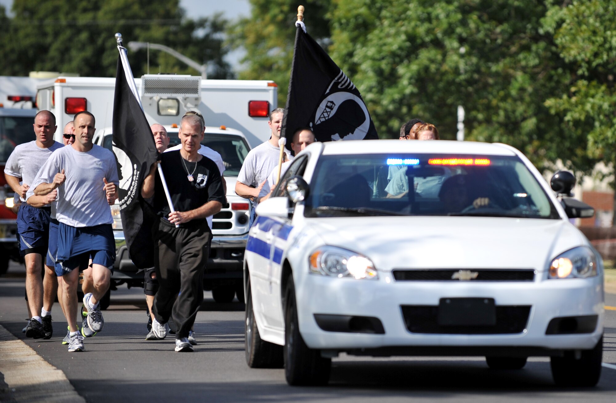 Runners participating in the 2013 POW/MIA Recognition Day 24-hour run head for the finish at Langley Air Force Base, Va., Sept. 20, 2013. The run was part of a 24-hour vigil, held to honor the nation’s prisoner of war and missing in action Service members. (U.S. Air Force photo by Staff Sgt. Jarad A. Denton/Released)