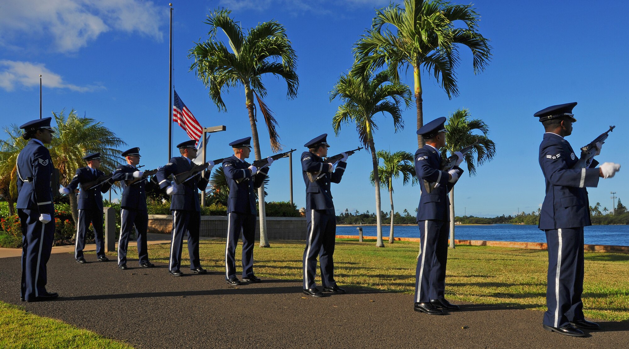 Members of the Joint Base Pearl Harbor-Hickam Honor Guard team perform a 21-gun salute in honor of national prisoners of war/missing in action recognition ceremony at the Missing Man Formation, JBPHH, Hawaii, Sept. 20, 2013. The custom stems from a naval tradition, where a warship would fire its cannons harmlessly out to sea, until all ammunition was spent, to show that it was disarmed, signifying the lack of hostile intent. (U.S. Air Force photo/Tech. Sgt. Jerome S. Tayborn)