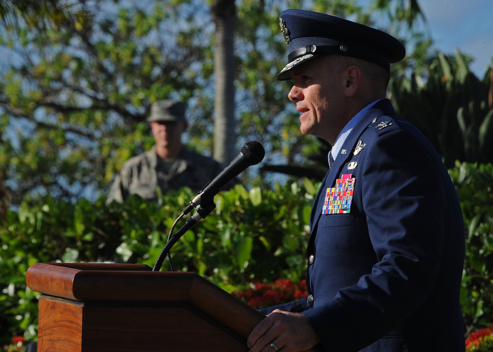 Col. John Roscoe, 15th Wing commander addresses the audience at the prisoners of war/missing in action remembrance ceremony at Missing Man Formation, Joint Base Pearl Harbor-Hickam, Hawaii, Sept. 20, 2013. (U.S. Air Force photo/Tech. Sgt. Jerome S. Tayborn)