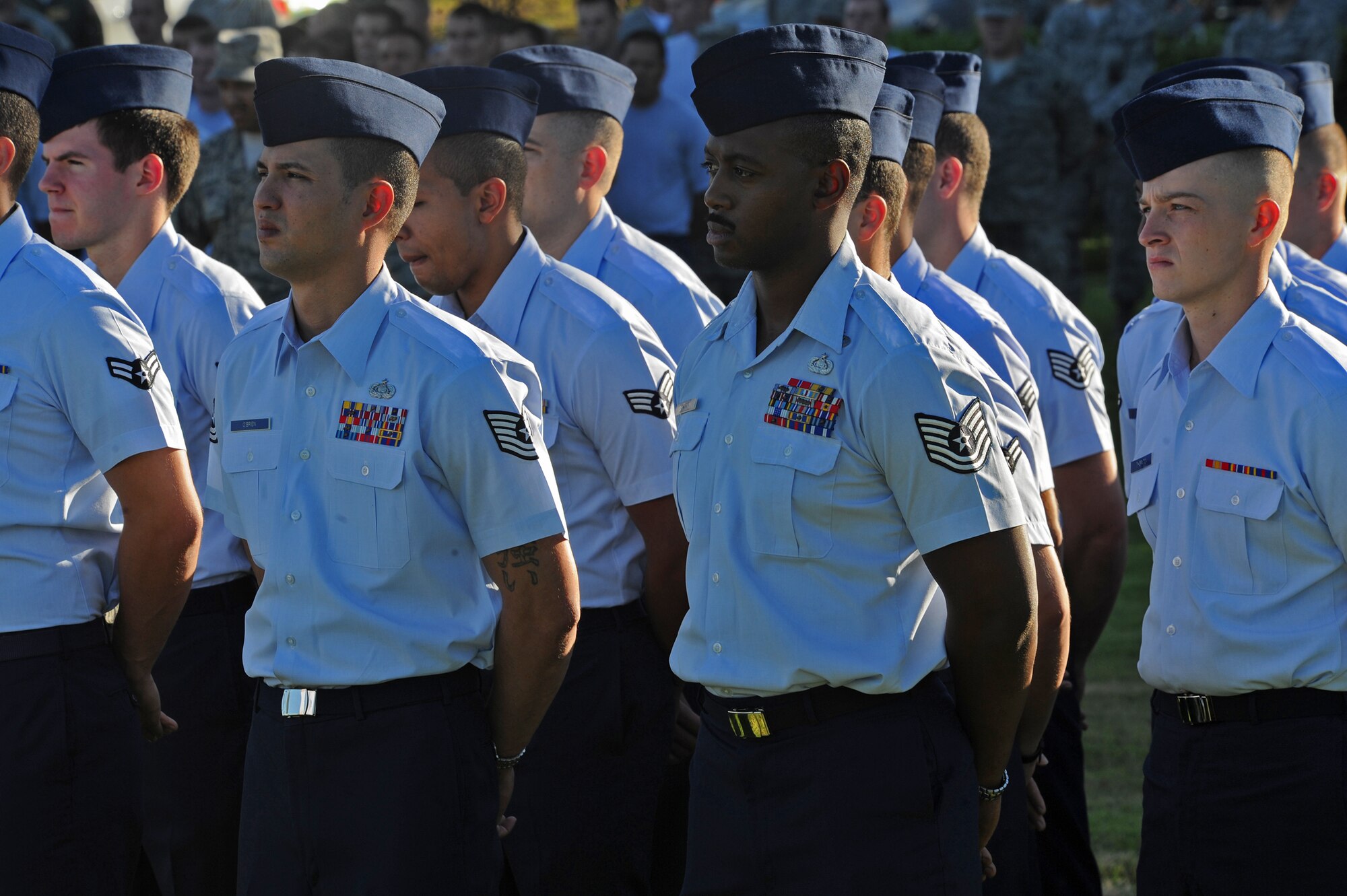 Members of the 15th Wing stand in formation during the prisoners of war/missing in action remembrance ceremony at the Missing Man Formation on Joint Base Pearl Harbor-Hickam, Hawaii,  Sept. 20, 2013. The Mission of the 15th Wing is to develop and sustain combat-ready Airmen, in partnership with the total force, to provide global mobility, global reach, precision engagement, and agile combat support ANYTIME, ANYWHERE. (U.S. Air Force photo/Tech. Sgt. Jerome S. Tayborn)