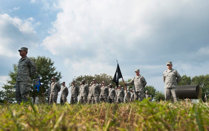 Joint Base Charleston Airmen stand in formation during the Prisoner of War/Missing in Action retreat ceremony Sept. 23, 2013, at Joint Base Charleston – Air Base, S.C. The empty formation on to the right represents servicemembers who are missing in action. (U.S. Air Force photo/Senior Airman Ashlee Galloway)