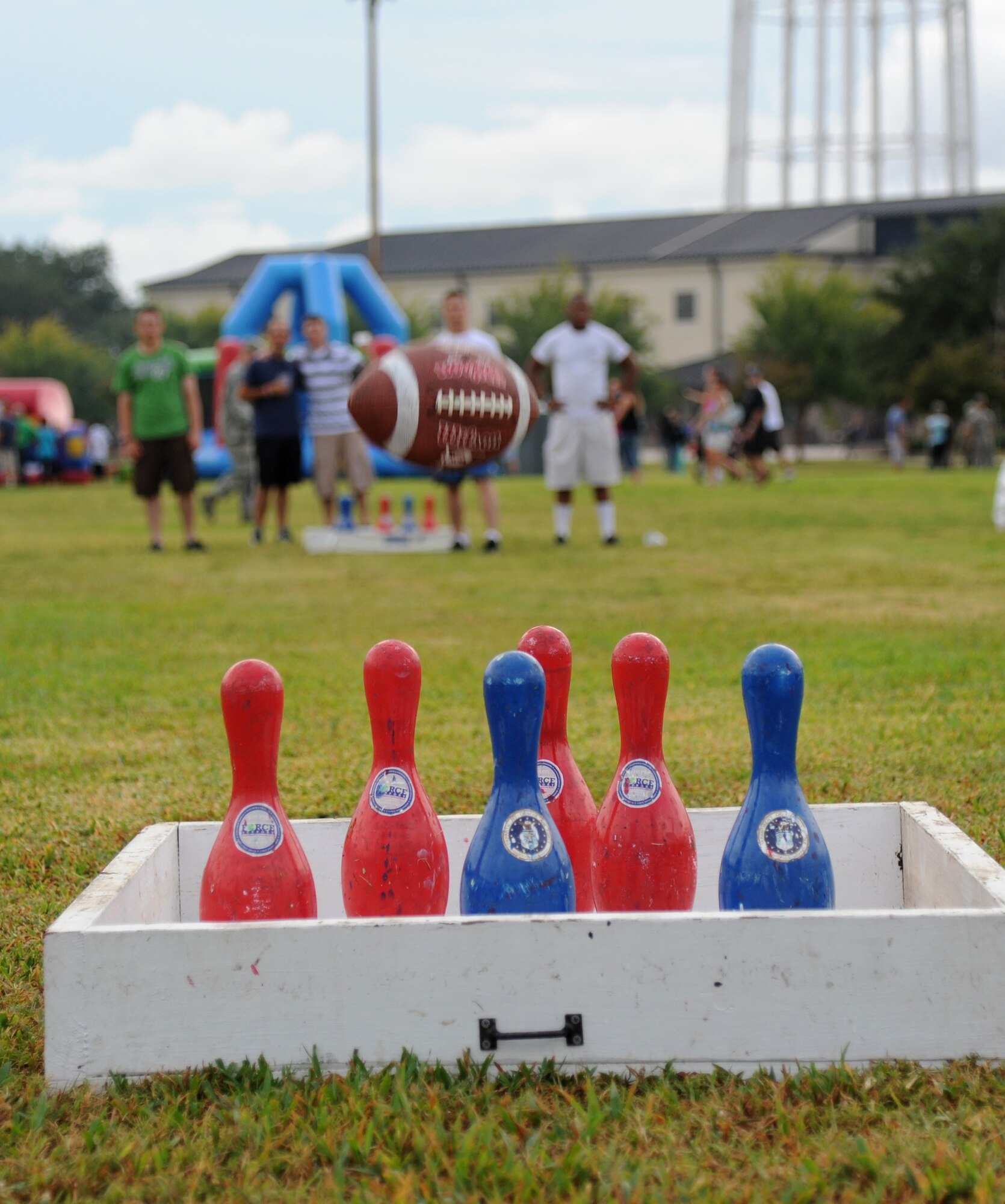 Keesler Airmen play a game of football bowling during the Air Force’s 66th birthday celebration Sept. 20, 2013, Keesler Air Force Base, Miss. The event also included a cake cutting ceremony, music, games, contests and food.  (U.S. Air Force photo by Kemberly Groue)