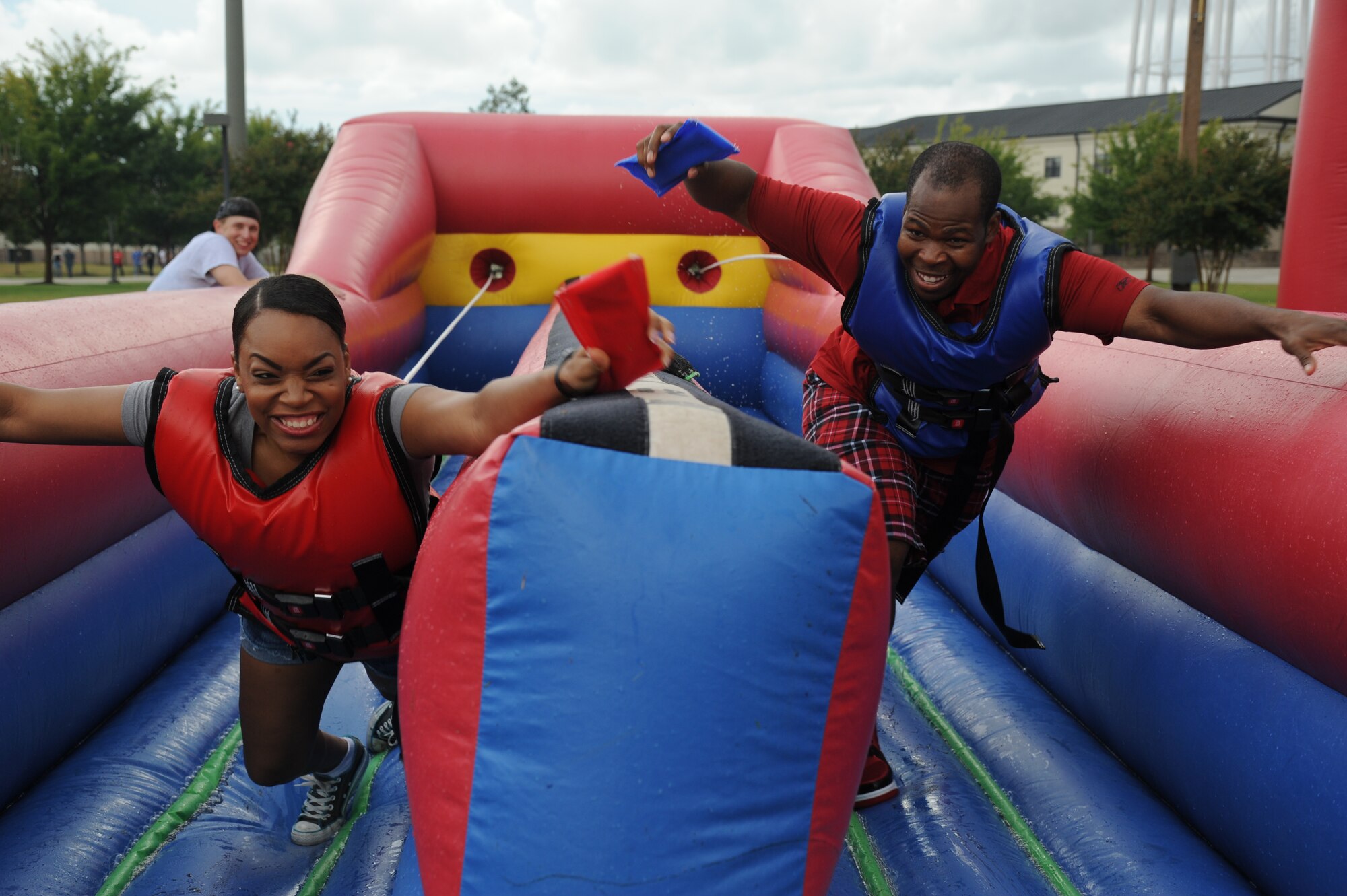 Staff Sgt. Morgan Jones, 81st Inpatient Operation Squadron, and Senior Airman Antwon Webster, 81st Logistics Readiness Squadron, compete in a bungee race during the Air Force’s 66th birthday celebration Sept. 20, 2013, Keesler Air Force Base, Miss. The event also included a cake cutting ceremony, music, games, contests and food.  (U.S. Air Force photo by Kemberly Groue)