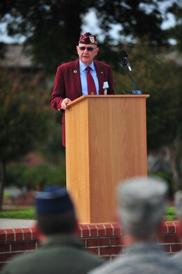 Retired Army Lt. Col. Ray Schrump addresses members of Team Seymour during the 4th Fighter Wing Prisoner of War/Missing in Action (POW/MIA) ceremony at Seymour Johnson Air Force Base, N.C., Sept. 20, 2013. Schrump spoke of the trials he faced as a prisoner during the Vietnam War for 1,727 days. (U.S. Air Force photo by Senior Airman Aubrey White)