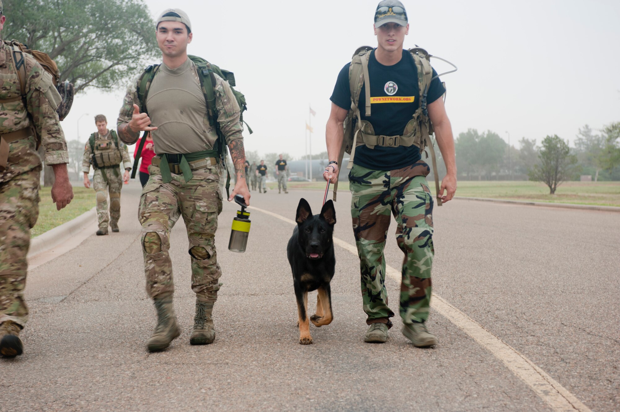 Members of the 27th Special Operations Wing participate in a ruck march to kick-off Prisoner of War/Missing in action week Sept. 16, 2013 at Cannon Air Force Base, N.M. Those who attended the ruck march took time to remember the POW/MIA personnel.(U.S. Air Force photo/Senior Airman Xavier Lockley)