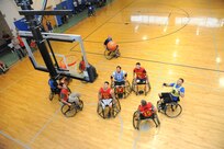 Wounded warriors compete against each other in an Air Force vs. Marine Corps wheelchair basketball game at the Air Force Wounded Warrior Program Adaptive Sports Camp Sept. 19 at the Joint Base San Antonio-Randolph Rambler Fitness Center. (U.S. Air Force photo by Melissa Peterson)