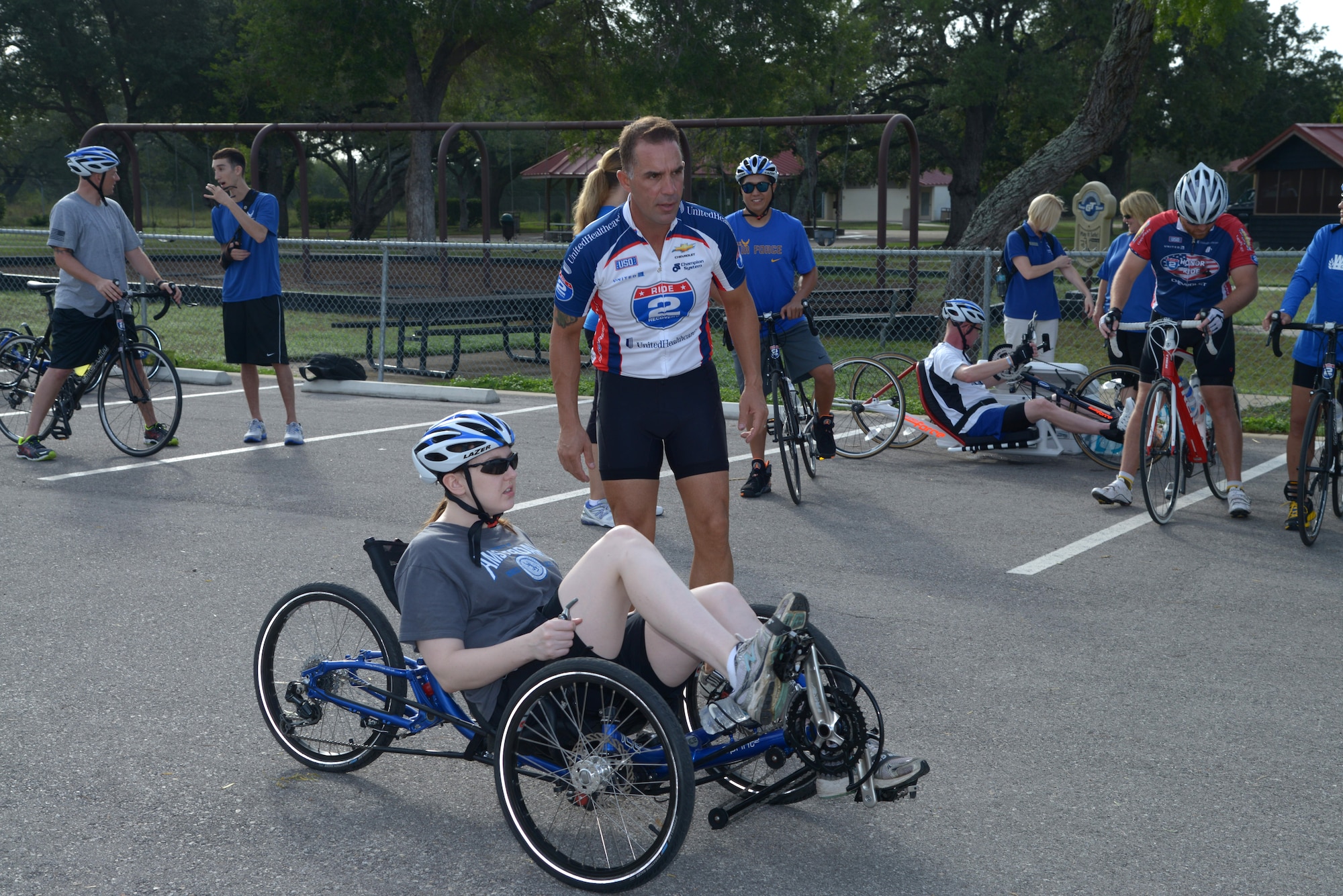 Troy Foster, Air Force Wounded Warrior Program Adaptive Sports Camp coordinator, discusses the cycling route with retired Staff Sgt. Megan Lyon Sept. 18 at Joint Base San Antonio-Randolph. The camp was provided by the Air Force Wounded Warrior Program, which introduces wounded, injured and ill Airmen to adaptive sports, such as wheelchair basketball and sitting volleyball, as early in the healing process as possible to get them interested in competing locally, or even at the national level at the Warrior Games in Colorado Springs, Colo. (U.S. Air Force photo by Joel Martinez/Released)