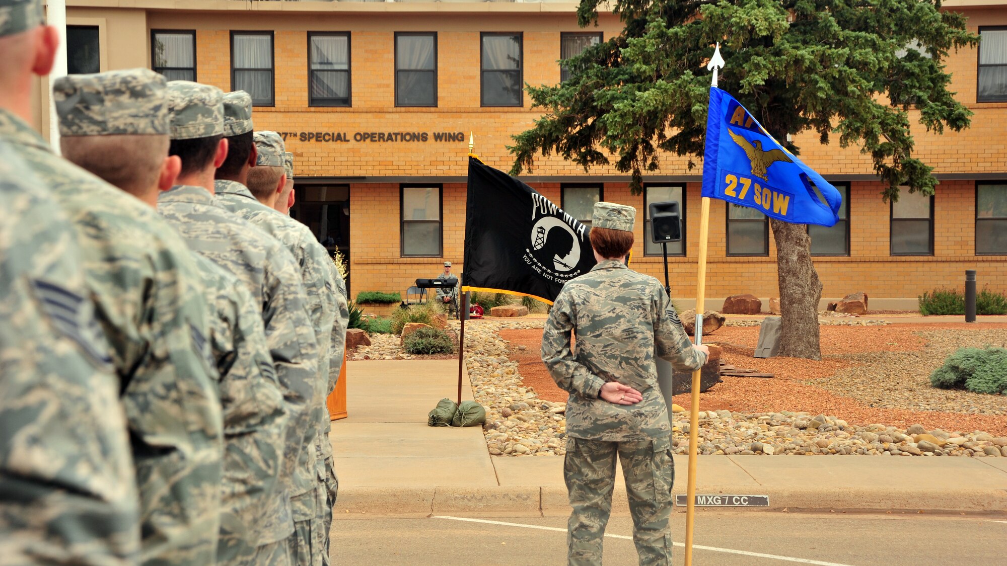 U.S. Air Force Air Commandos stand in formation and listen attentively during a Prisoner of War/Missing in Action retreat ceremony Sept. 20, 2013 at Cannon Air Force Base, N.M. Since 1979, POW/MIA Day has been observed across the nation on the third Friday of September each year, allowing Americans to remember those service members who made selfless sacrifices for their nation and those who never came home. (U.S. Air Force photo/Senior Airman Whitney Tucker)