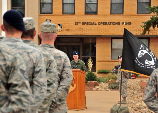 U.S. Air Force Lt. Col. Travis Norton, 3rd Special Operations Squadron commander, addresses attendees during a Prisoner of War/Missing in Action retreat ceremony Sept. 20, 2013 at Cannon Air Force Base, N.M. Since 1979, POW/MIA Day has been observed across the nation on the third Friday of September each year, allowing Americans to remember those service members who made selfless sacrifices for their nation and those who never came home. (U.S. Air Force photo/Senior Airman Whitney Tucker)