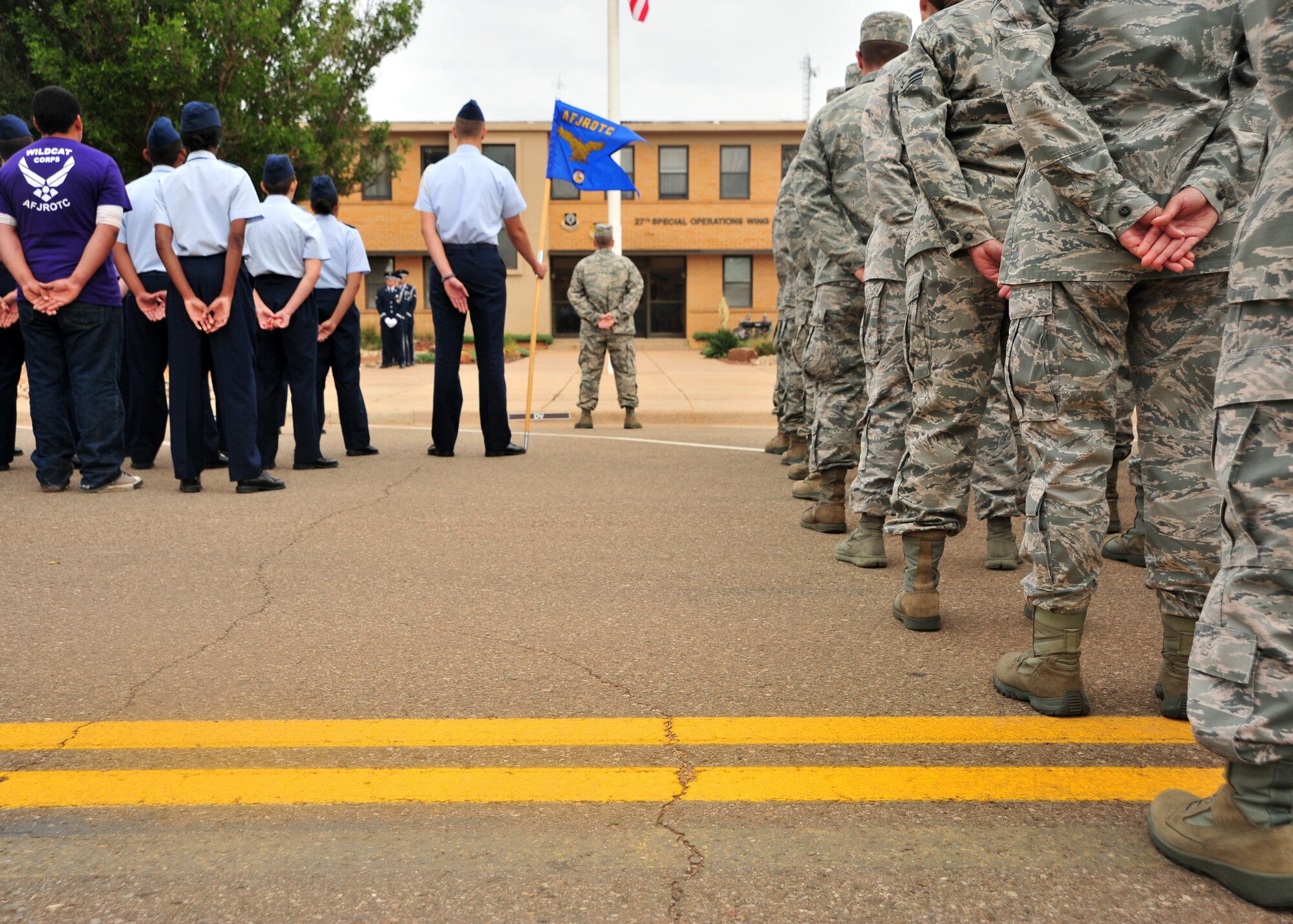 U.S. Air Force Air Commandos and members of Clovis High School’s JROTC listen attentively during a Prisoner of War/Missing in Action retreat ceremony Sept. 20, 2013 at Cannon Air Force Base, N.M. Since 1979, POW/MIA Day has been observed across the nation on the third Friday of September each year, allowing Americans to remember those service members who made selfless sacrifices for their nation and those who never came home. (U.S. Air Force photo/Senior Airman Whitney Tucker)