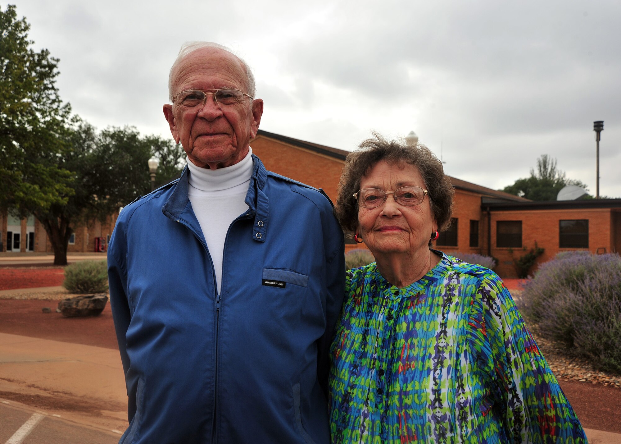 Clovis, N.M., veteran Dan McKinney, a former prisoner of war and Hall of Heroes inductee, stands with his wife, Joyce Anne, prior to a Prisoner of War/Missing in Action retreat ceremony Sept. 20, 2013 at Cannon Air Force Base, N.M. Since 1979, POW/MIA Day has been observed across the nation on the third Friday of September each year, allowing Americans to remember those service members who made selfless sacrifices for their nation and those who never came home. (U.S. Air Force photo/Senior Airman Whitney Tucker)