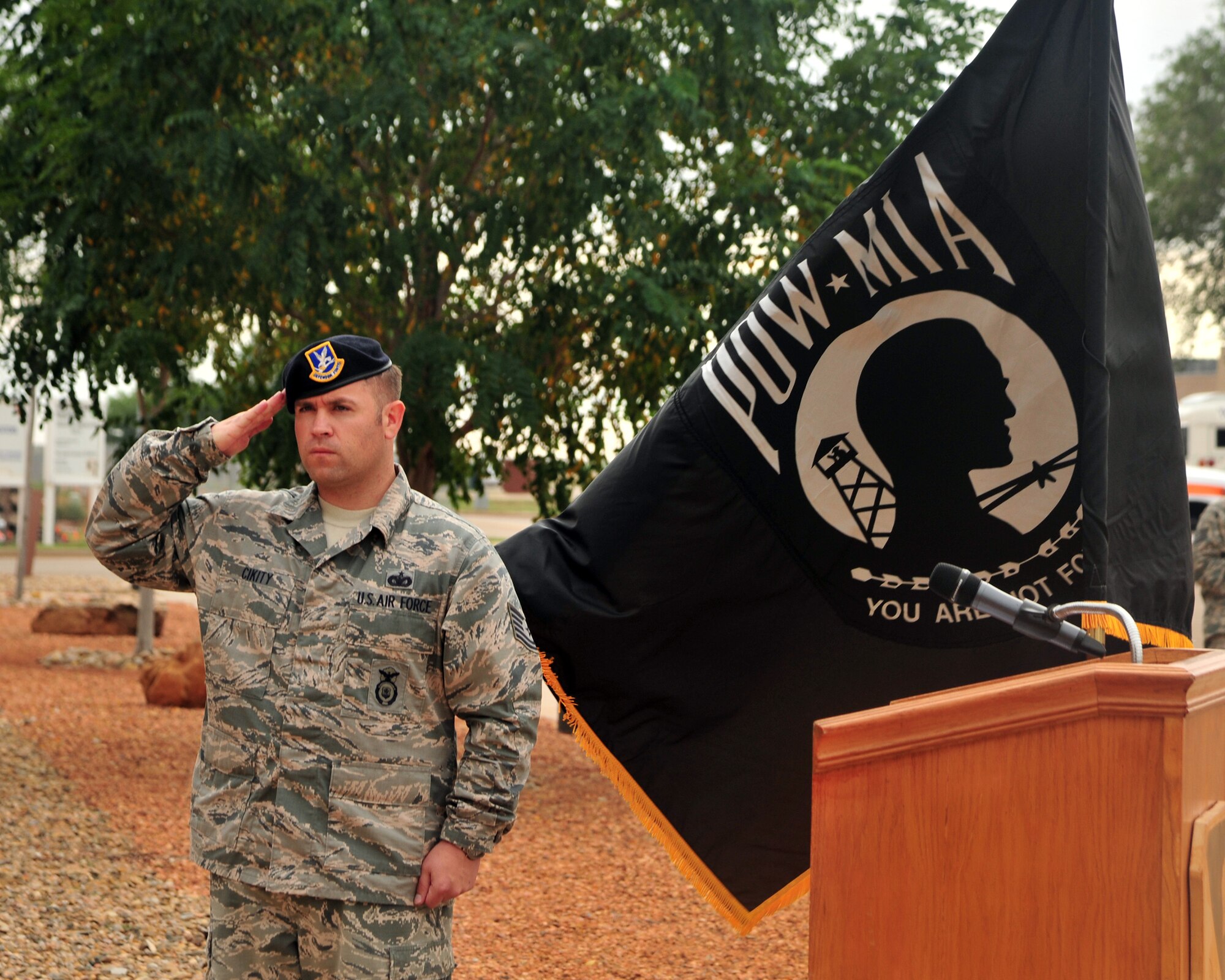 U.S. Air Force Tech. Sgt. Brian Cikity, 27th Special Operations Security Forces Squadron response force leader, renders a salute during a Prisoner of War/Missing in Action retreat ceremony Sept. 20, 2013 at Cannon Air Force Base, N.M. Since 1979, POW/MIA Day has been observed across the nation on the third Friday of September each year, allowing Americans to remember those service members who made selfless sacrifices for their nation and those who never came home. (U.S. Air Force photo/Senior Airman Whitney Tucker)