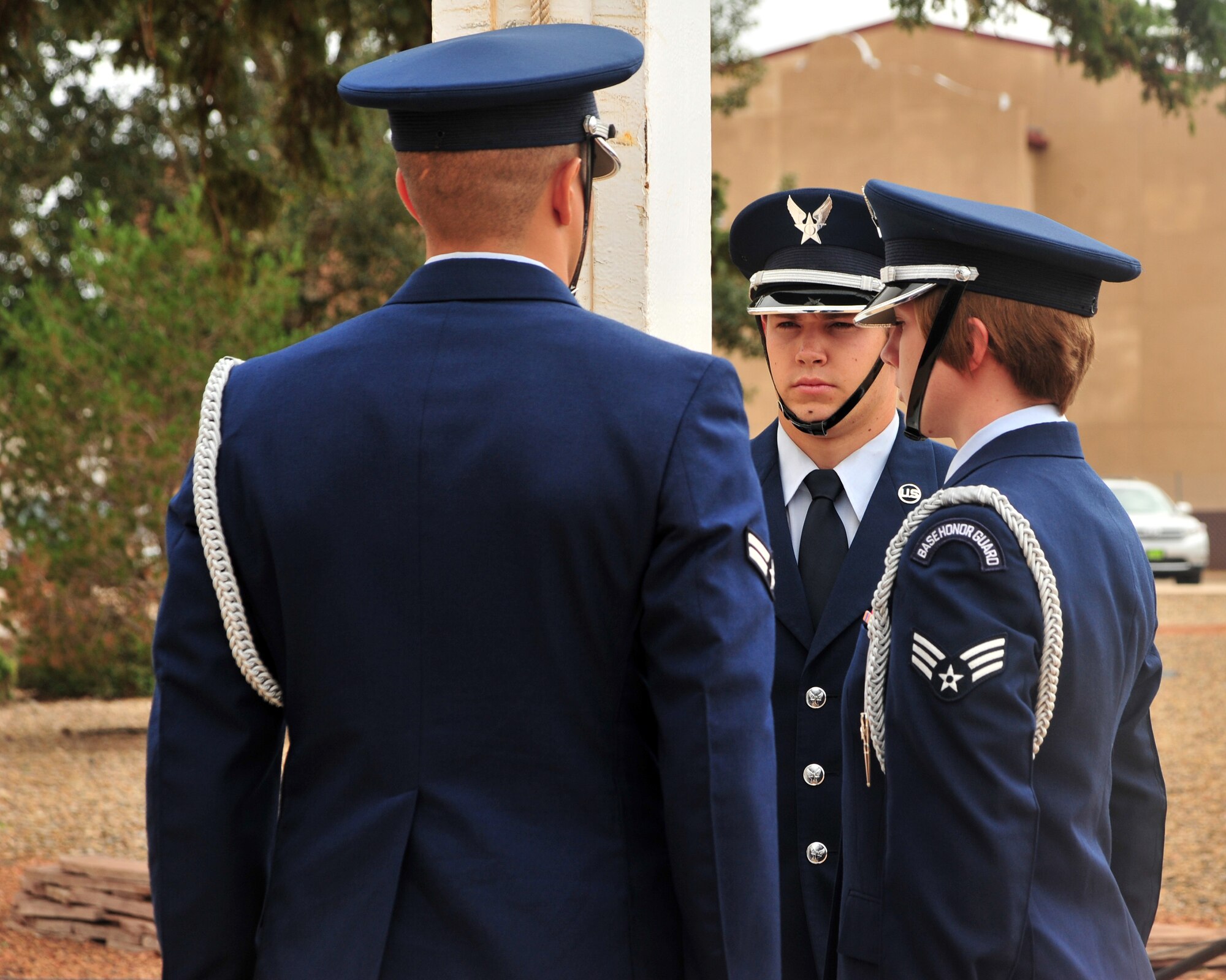 Members of the base honor guard prepare to receive the flag during a Prisoner of War/Missing in Action retreat ceremony Sept. 20, 2013 at Cannon Air Force Base, N.M. Since 1979, POW/MIA Day has been observed across the nation on the third Friday of September each year, allowing Americans to remember those service members who made selfless sacrifices for their nation and those who never came home. (U.S. Air Force photo/Senior Airman Whitney Tucker)