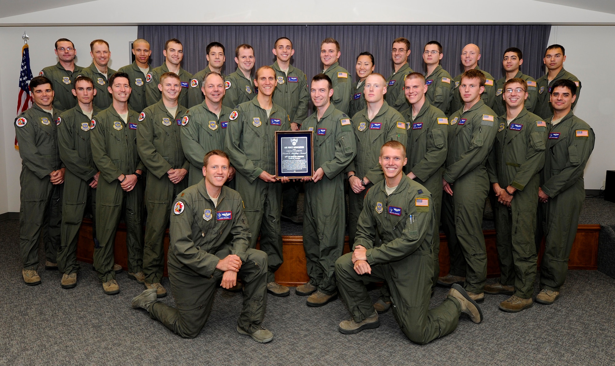 Members of the 93rd Air Refueling Squadron, pose for a photo with the
Schilling Award at Fairchild Air Force Base, Wash., Sept. 20, 2013. The 93rd
ARS provided aerial refueling support on more than 1,300 overseas combat
missions offloading 82-million pounds of fuel while sustaining over 6,000
hours of ground alert supporting Operation Noble Eagle. The 93rd ARS is the
second refueling squadron to receive the award in its 65 year history. (U.S.
Air Force photo by Airman 1st Class Ryan Zeski/Released)
