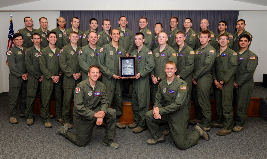Members of the 93rd Air Refueling Squadron, pose for a photo with the
Schilling Award at Fairchild Air Force Base, Wash., Sept. 20, 2013. The 93rd
ARS provided aerial refueling support on more than 1,300 overseas combat
missions offloading 82-million pounds of fuel while sustaining over 6,000
hours of ground alert supporting Operation Noble Eagle. The 93rd ARS is the
second refueling squadron to receive the award in its 65 year history. (U.S.
Air Force photo by Airman 1st Class Ryan Zeski/Released)
