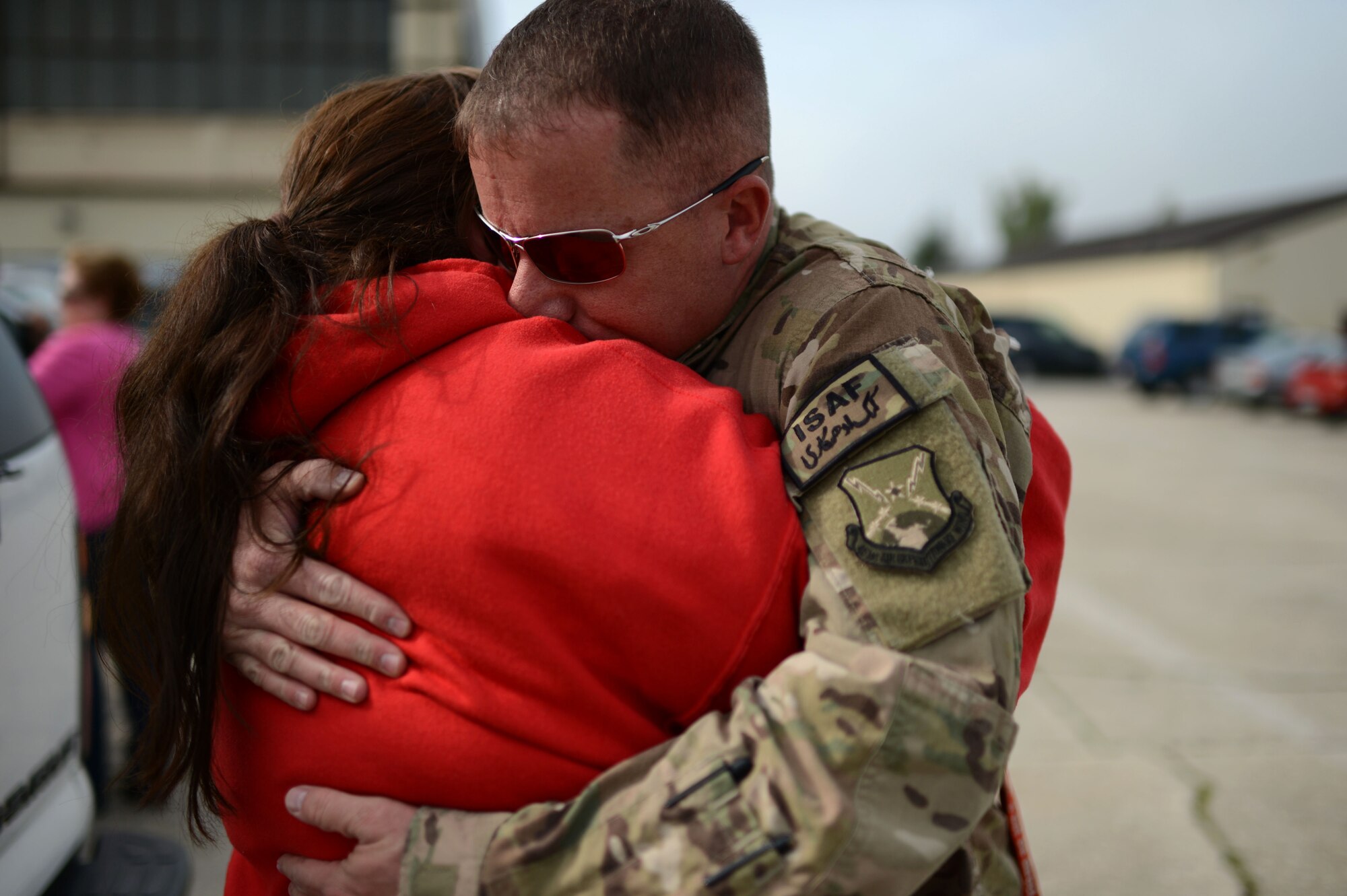SPANGDAHLEM AIR BASE, Germany – Julia Martel hugs her husband, U.S. Air Force Master Sgt. Joseph Martell, 480th Aircraft Maintenance Unit lead production superintendent from Ocala, Fla., after returning from a deployment Sept. 21, 2013, to Southwest Asia in support of Operation Enduring Freedom. The men and women of the 480th AMU deployed with the specific goal of delivering safe, reliable, airworthy, combat-ready aircraft to provide close air support to friendly ground forces. (U.S. Air Force photo by Airman 1st Class Gustavo Castillo/Released)