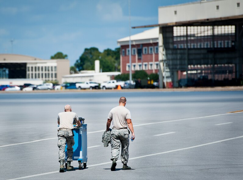 Airmen with the 96th Maintenance Group move tools across the Eglin Air Force Base flightline Sept. 20.  The 96th Maintenance Group is responsible for all aircraft maintenance for the 96th Test Wing and 53rd Wing here at Eglin.  (U.S. Air Force photo/Tech. Sgt. Jasmin Taylor)